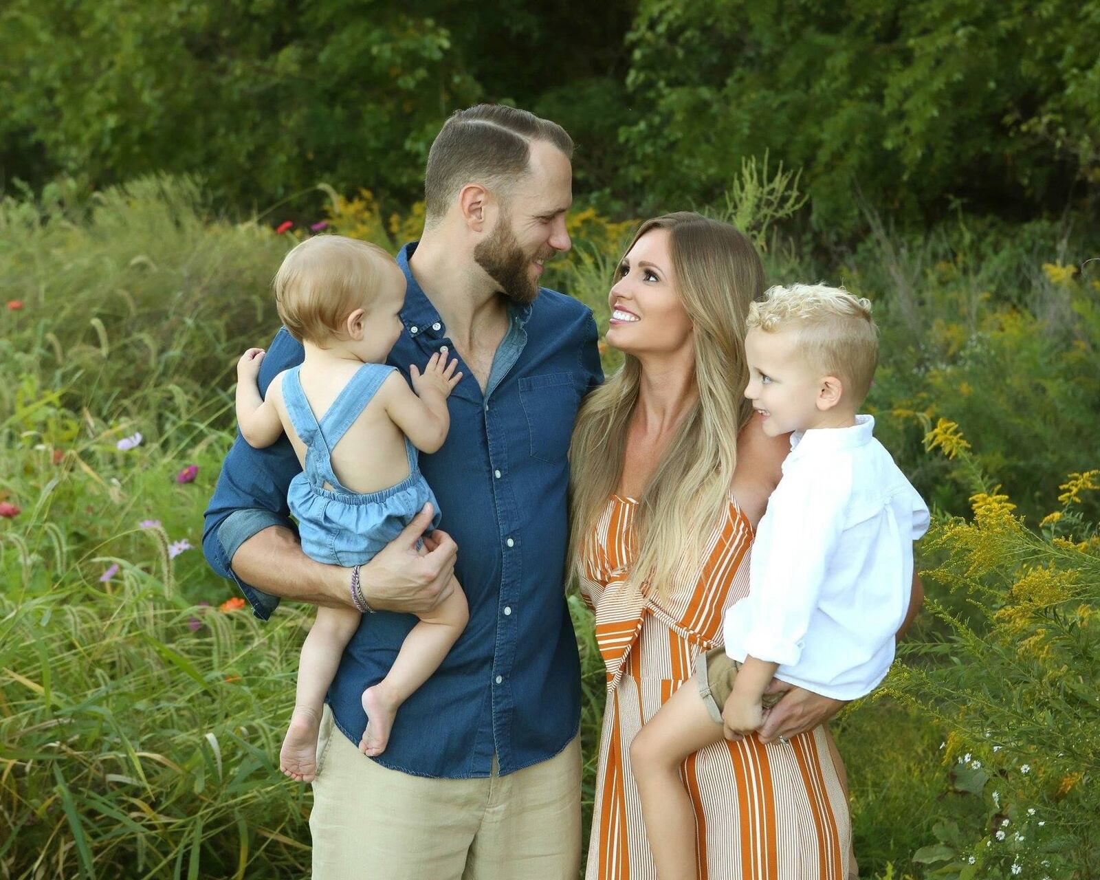 Former Wright State basketball standouts Vaughn Duggins and Maria Bennett and their two kids — son Gianni, 3, and daughter Penelope, 17 months. CONTIRBUTED