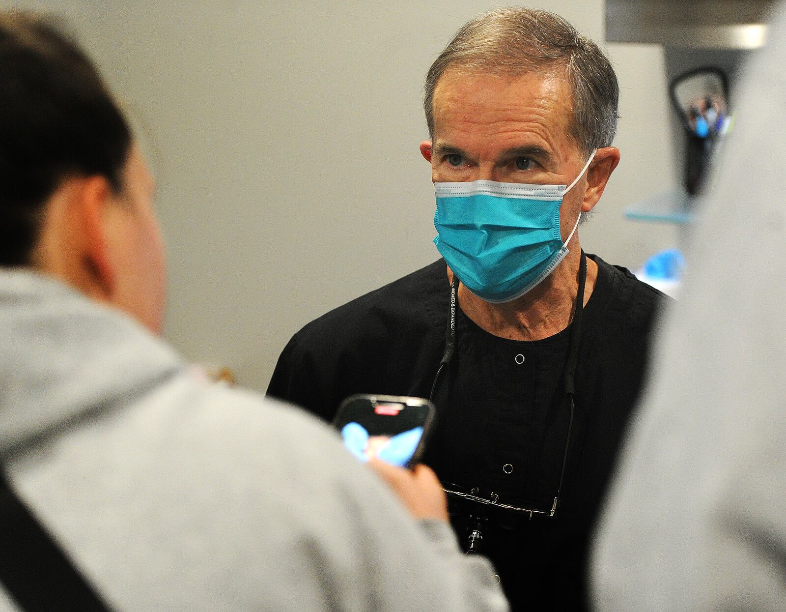 Dr. Gregory Notestine talks to a patients parents Friday, Jan. 26, 2024 at PedZ Dental located at 5671 Far Hills Ave. MARSHALL GORBY\STAFF