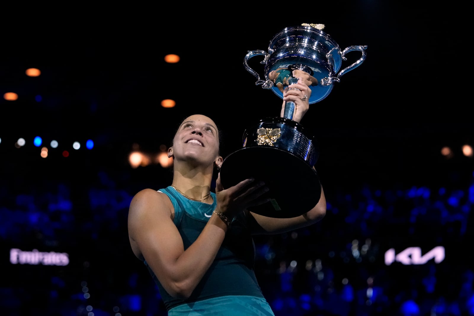 Madison Keys of the U.S. holds the Daphne Akhurst Memorial Cup aloft after defeating Aryna Sabalenka of Belarus in the women's singles final at the Australian Open tennis championship in Melbourne, Australia, Saturday, Jan. 25, 2025. (AP Photo/Asanka Brendon Ratnayake)