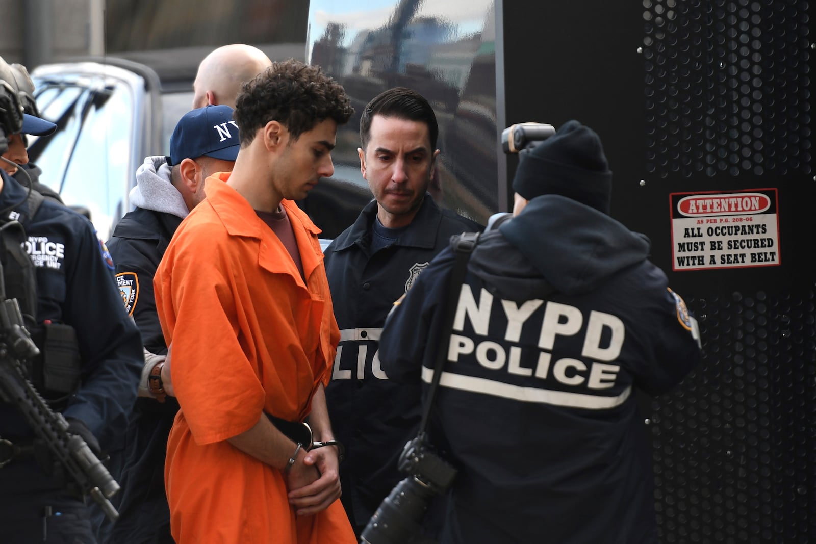 Luigi Mangione, a suspect in the fatal shooting of UnitedHealthcare CEO Brian Thompson, is escorted by police, Thursday, Dec. 19, 2024, in New York. (AP Photo/Pamela Smith)