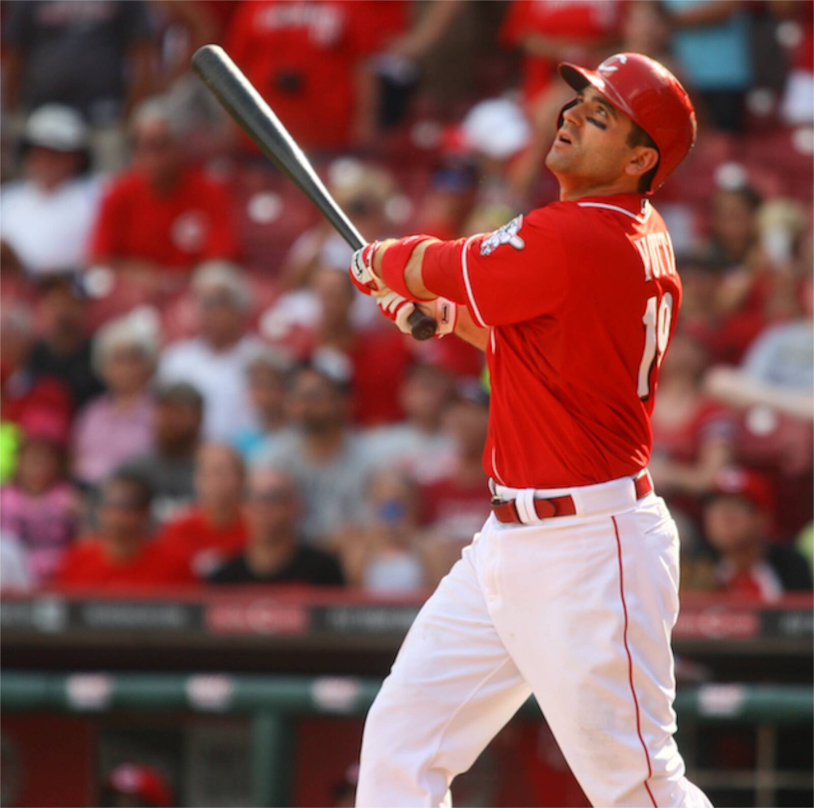 The Reds' Joey Votto watches the flight of his game-winning sacrifice fly in the 13th inning Sunday, Aug. 11, 2013, at Great American Ball Park in Cincinnati. David Jablonski/Staff