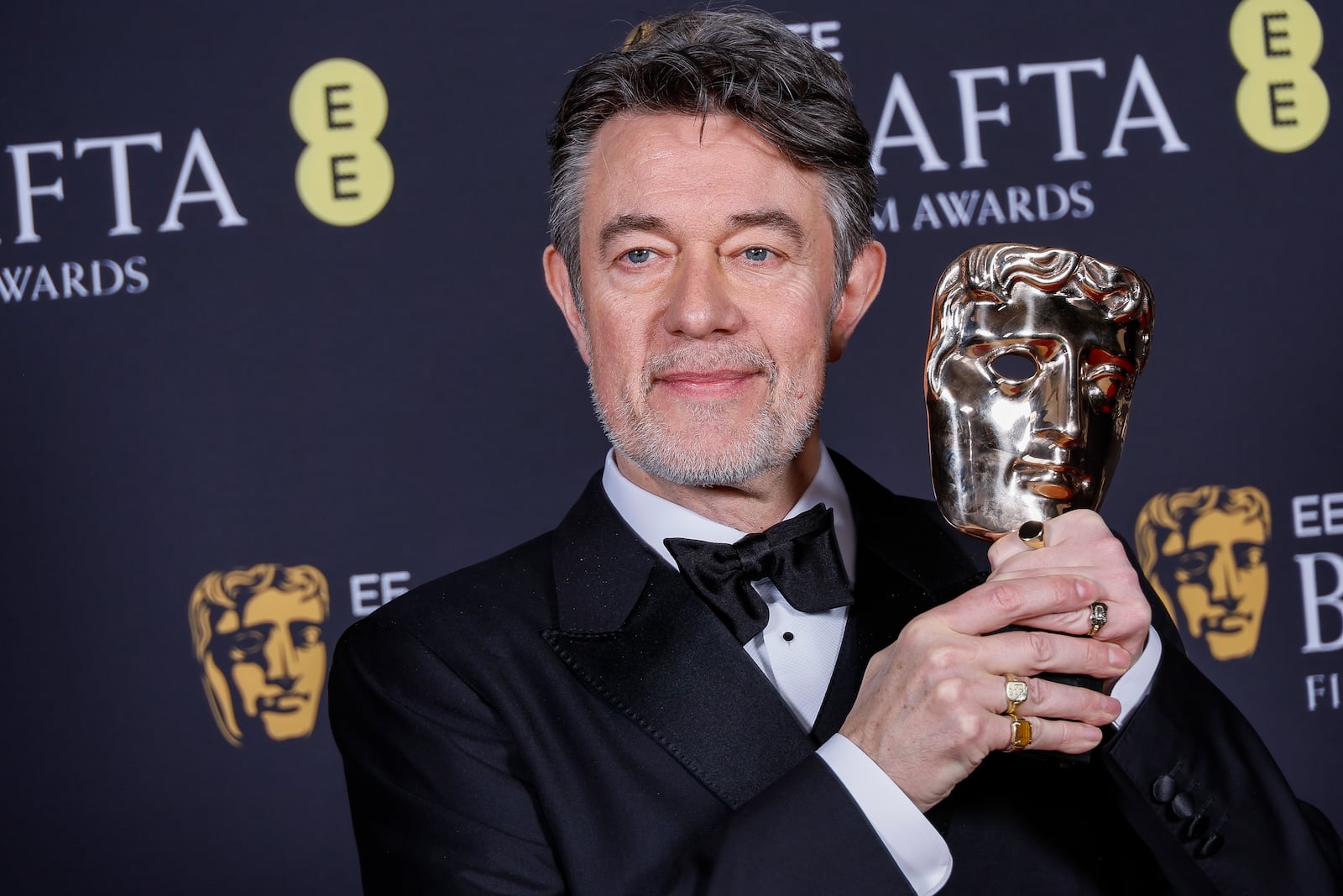 Peter Straughan poses with the adapted screenplay award for 'Conclave' at the 78th British Academy Film Awards, BAFTA's, in London, Sunday, Feb. 16, 2025. (Photo by Joel C Ryan/Invision/AP)