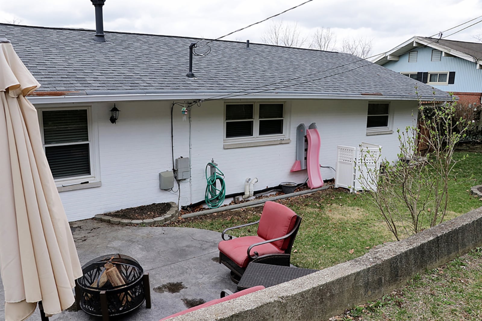 A side door opens from the dining area to the side yard with a walkway to the backyard patio. CONTRIBUTED PHOTO BY KATHY TYLER