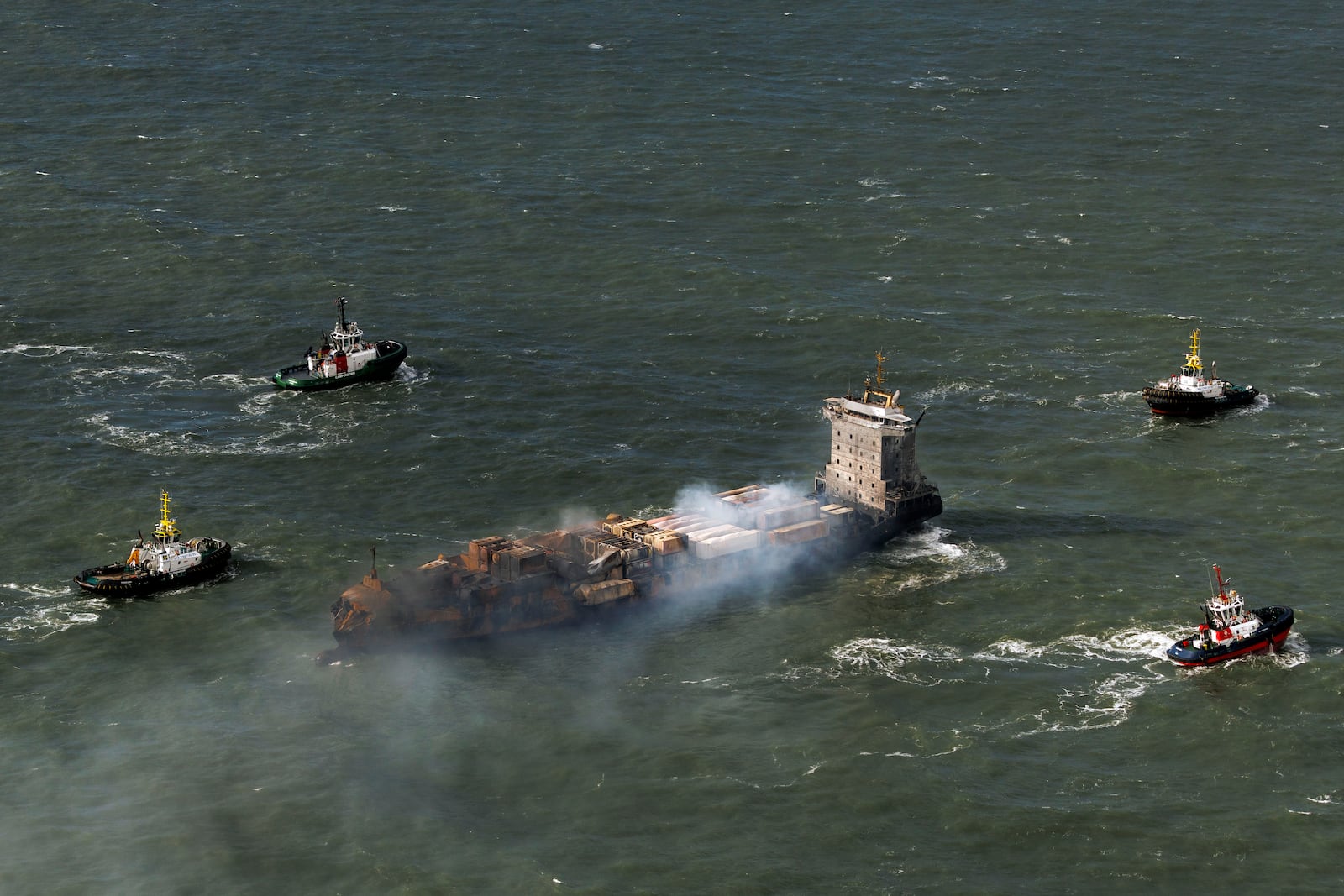 Smoke billows from the MV Solong cargo ship in the North Sea, off the Yorkshire coast in England, Tuesday, March 11, 2025. (Dan Kitwood/Pool Photo via AP)