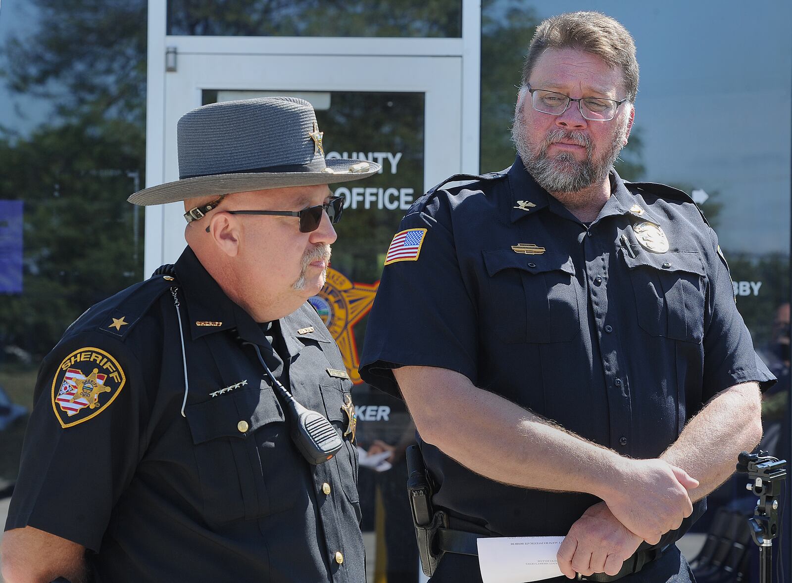 Darke County Sheriff, Mark Whittaker, left and Greenville Police Chief, Eric Roberts talk about a homicide investigation of a man who was reported missing and was found in a shallow grave in a rural area of Darke County on Saturday.  MARSHALL GORBY\STAFF