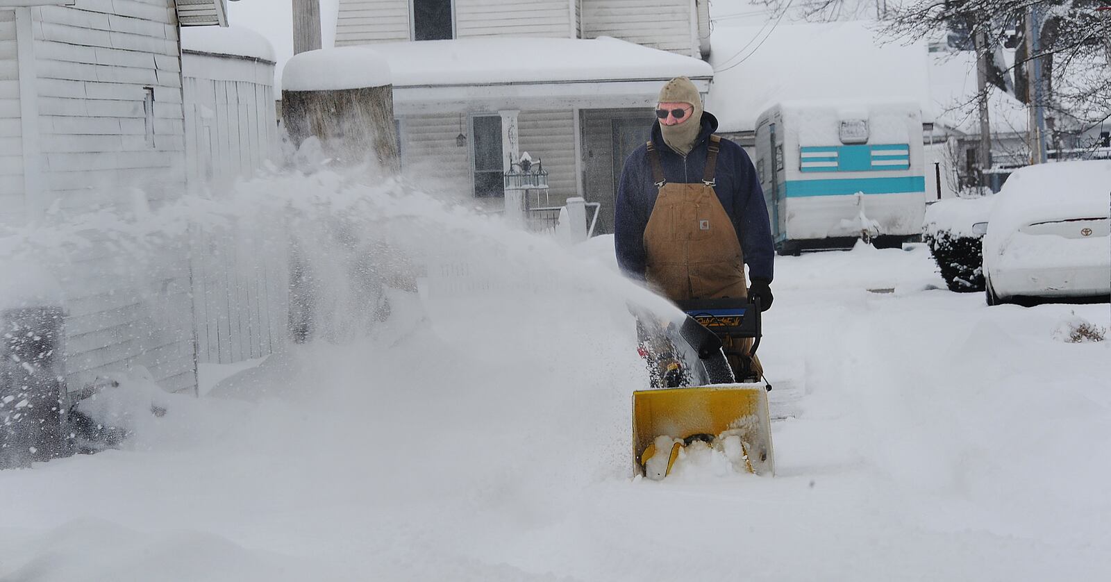 Residences of Jamestown we’re up early clearing driveways on sidewalks Tuesday morning, Feb. 9, 2021 after a heavy snowfall overnight. MARSHALL GORBY\STAFF