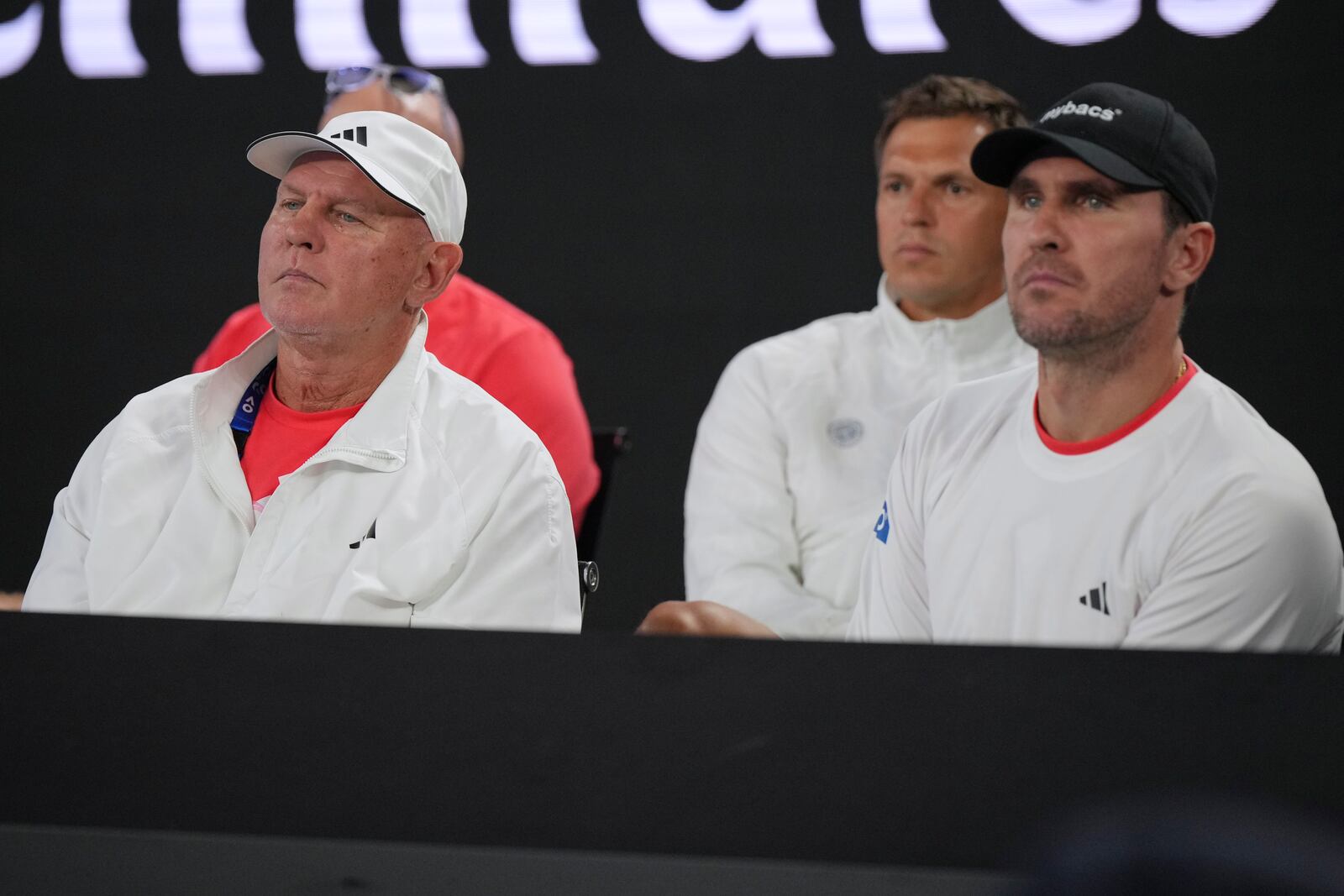 Coaches for Alexander Zverev of Germany watch his first round match against Lucas Pouille of France at the Australian Open tennis championship in Melbourne, Australia, Sunday, Jan. 12, 2025. (AP Photo/Vincent Thian)