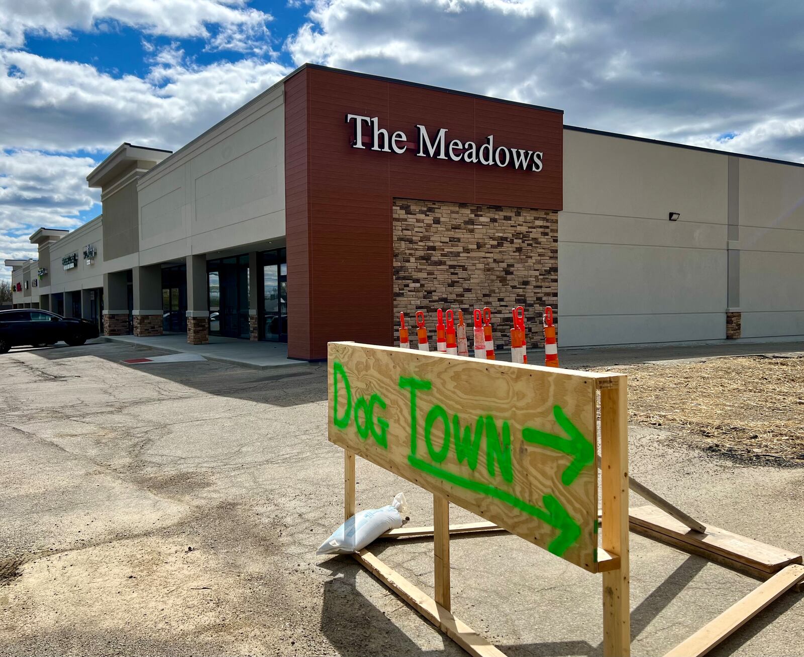 The strip mall at the corner of Brandt Pike and Fishburg Road in Huber Heights has been revamped, and ground work has begun nearby on the site of the former Marian Meadows shopping center. AIMEE HANCOCK/STAFF