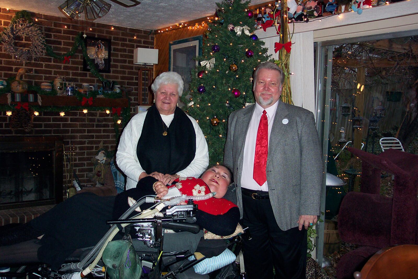 Maria Matzik has been wheelchair bound for most of her life. She has a form of muscular dystrophy and today advocates for other disabled people. She is shown in Christmas of 2009 with her mother, June Matzik, and her life partner, Alan Cochrun. CONTRIBUTED