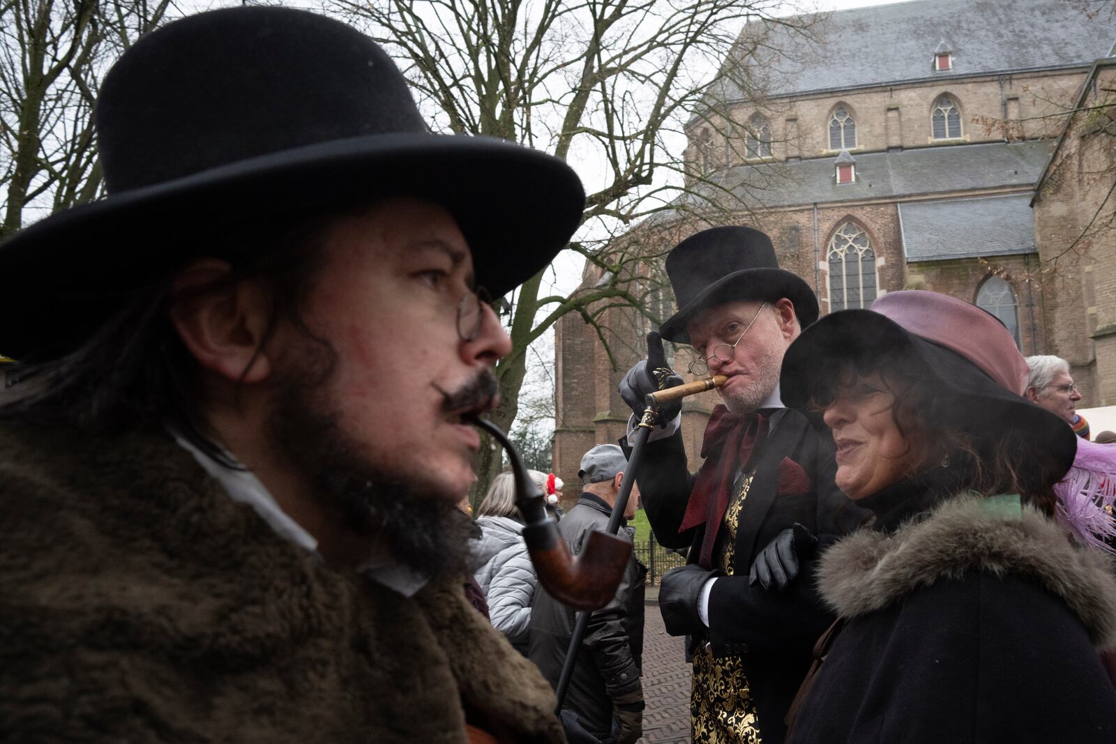 People in costumes from Charles Dickens' 19th-century English era take part in a Dickens Festival, in Deventer, Netherlands, Saturday, Dec. 14, 2024. (AP Photo/Peter Dejong)