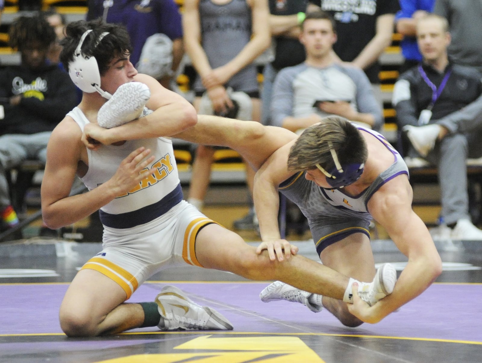 Gavin Brown of Legacy Christian (left) decisioned Logan Hoskins of Butler 3-1 in OT in the 126-pound final of the GMVWA Holiday Tournament at Vandalia on Friday, Dec. 28, 2018. MARC PENDLETON / STAFF