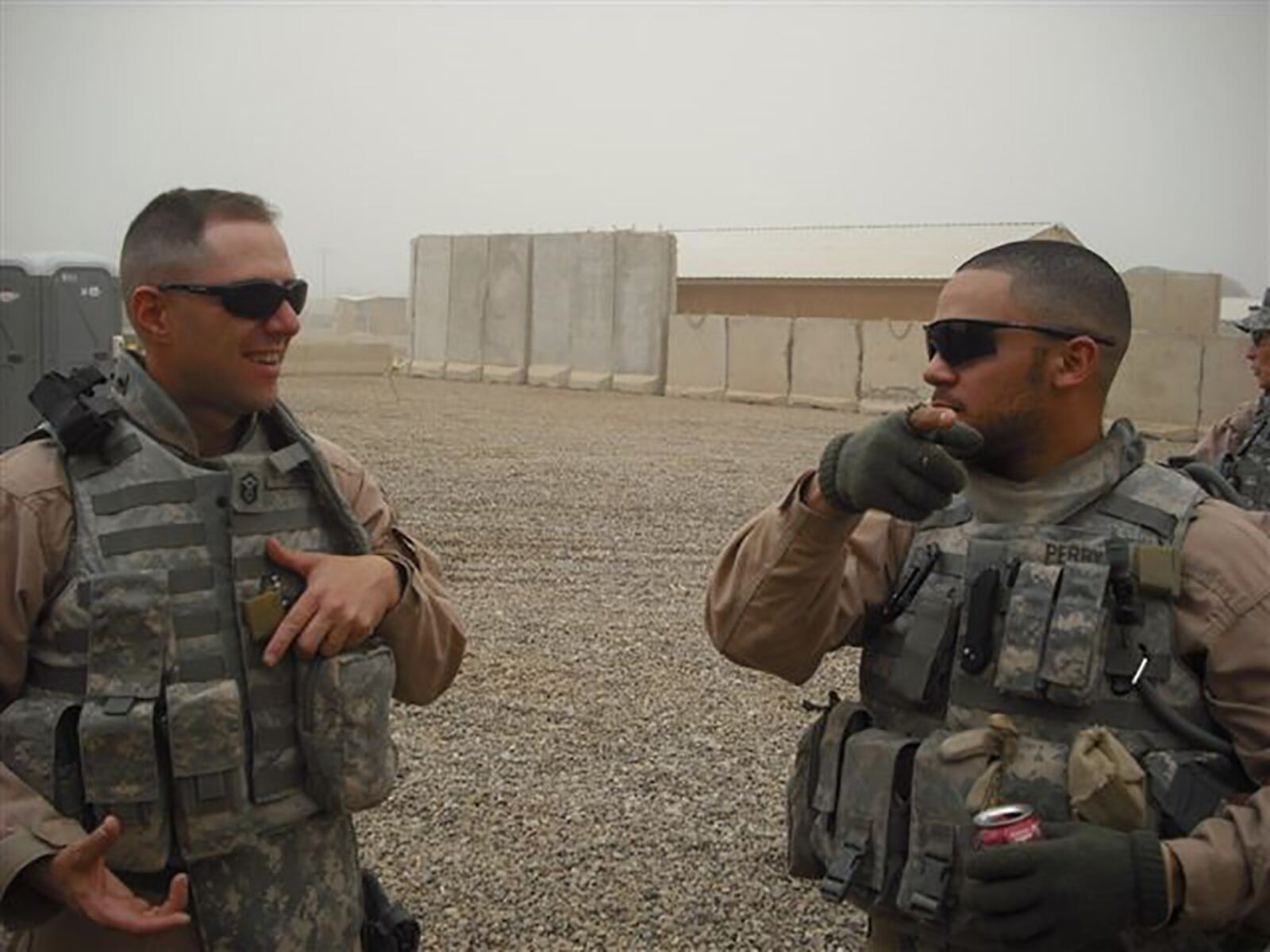 Chief Master Sgt. Stanley Cadell (left) discusses tactics and training on weapons for Iraqi Police during a deployment to Forward Operating Base Mahmudiyah and Camp Stryker, Iraq. Cadell deployed to Iraq from November 2008 to January 2010. CONTRIBUTED PHOTO