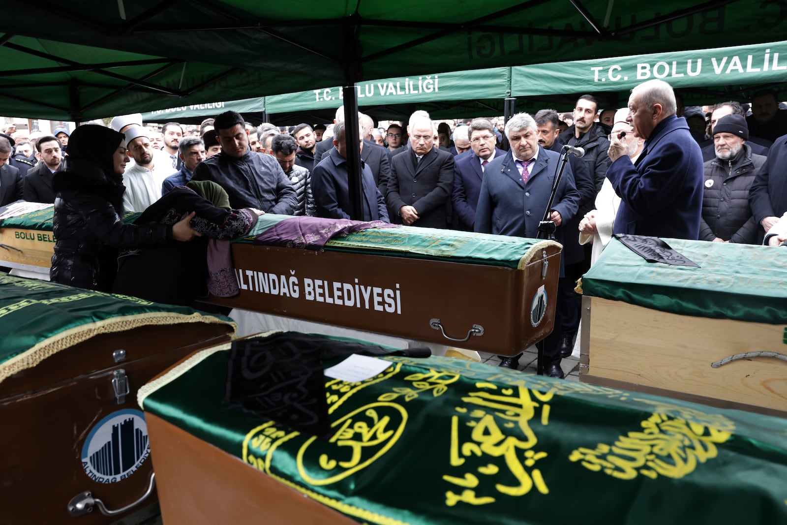 Turkey's President Recep Tayyip Erdogan, right, attends the funeral of members of the Gultekin family at the Kalici Konutlar Merkez mosque in Bolu, northwest Turkey, on Wednesday, Jan. 22, 2025. Eight members of the Gultekin family died in a fire that broke out at the Kartalkaya ski resort in Bolu province. (Adem Altan/Pool Photo via AP)