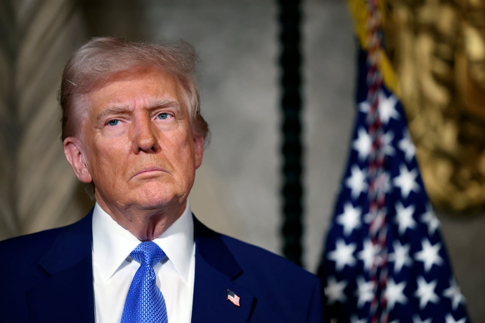 President Donald Trump speaks to the media at Mar-a-Lago, Tuesday, Feb. 18, 2025, in Palm Beach, Fla. (Pool photo via AP)