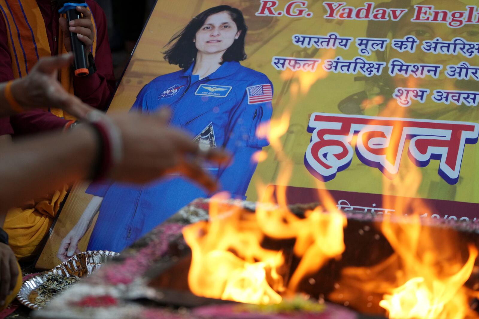 Indians performs rituals for the safe return of American astronaut of Indian origin Sunita Williams from the International Space Station (ISS), in Ahmedabad, India, Tuesday, March 18, 2025. (AP Photo/Ajit Solanki)