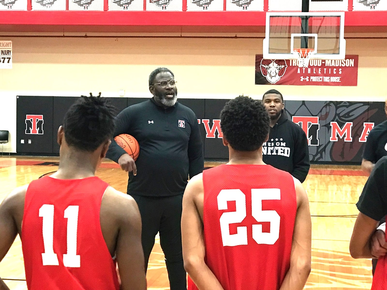 Carl Blanton talking to his team after practice Monday. Tom Archdeacon/CONTRIBUTED