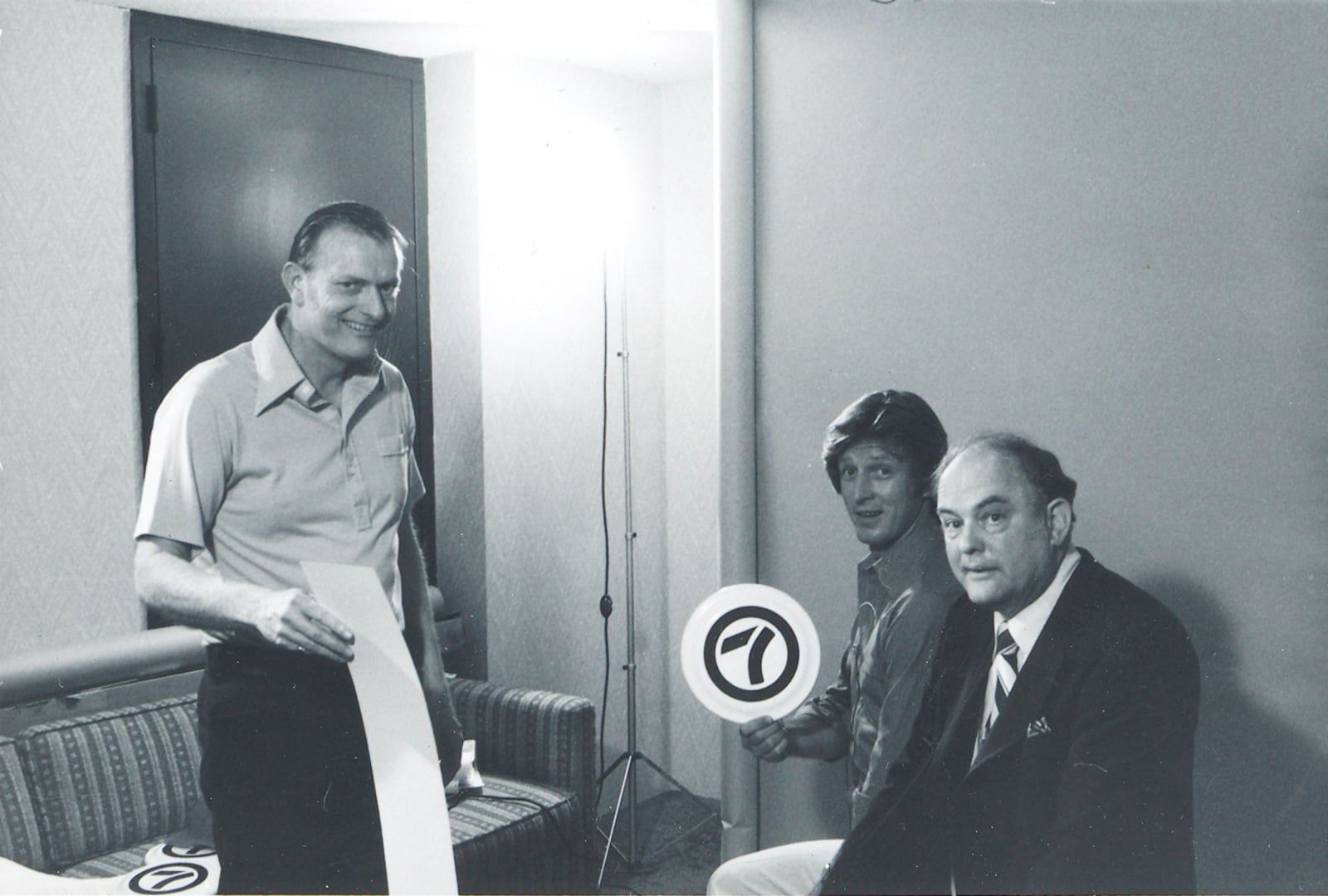 "WKRP in Cincinnati" stars Gary Sandy, from Kettering (center), Dayton native Gordon Jump and Middletown native, director-producer Robert Wells (left) work on a promotional shoot for WHIO-TV Channel 7. Sandy shows off his Channel 7 frisbee (date unknown) Wells spent more than 30 years working at TV stations in Dayton and Cincinnati. View more photos of famous visitors to Dayton