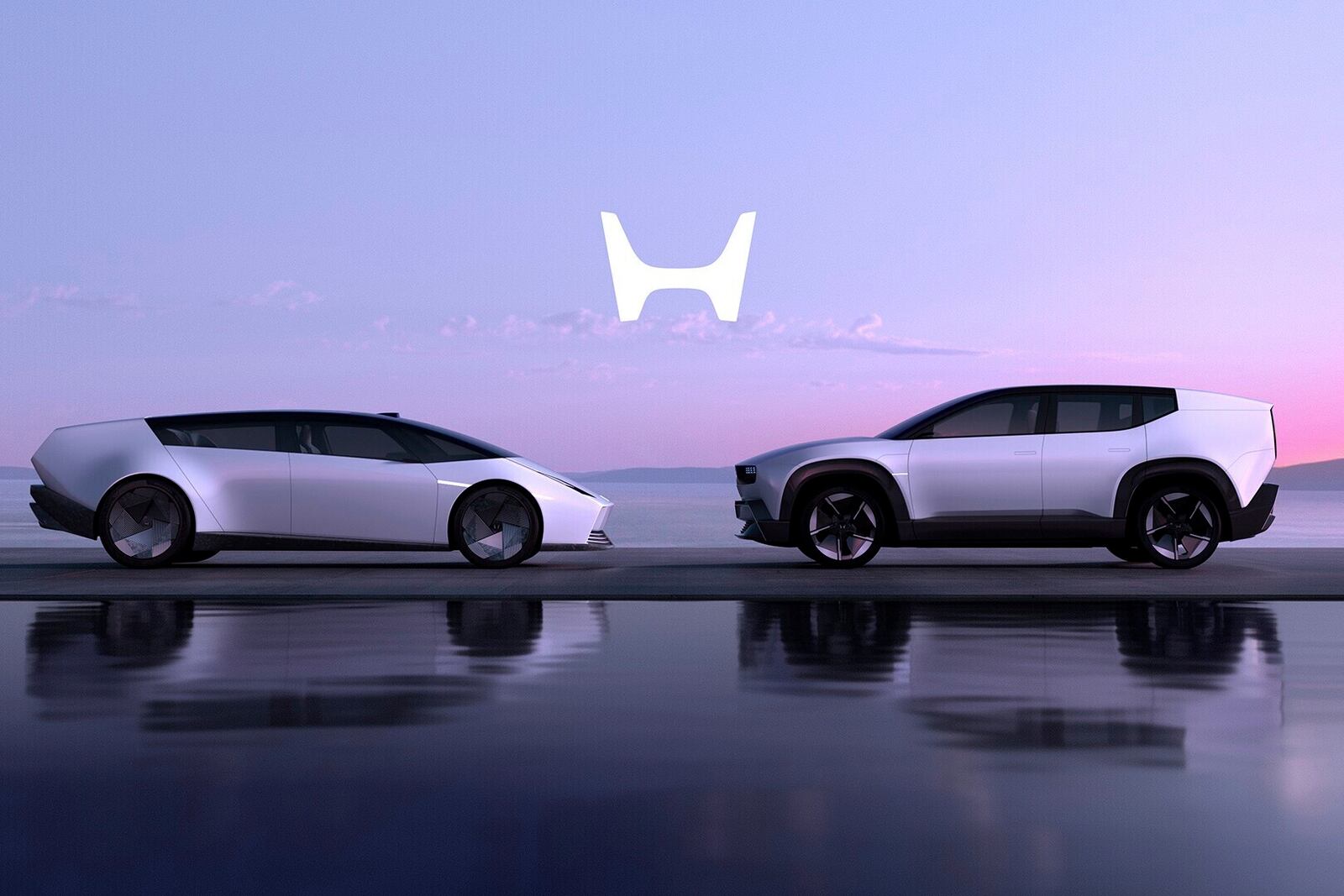 This photo provided by Honda shows its new 0 SUV and 0 Saloon electric vehicles. Honda hasn't provided many details but does say the vehicles will be capable of Level 3 automated driving. (Courtesy of American Honda Motor Co. via AP)