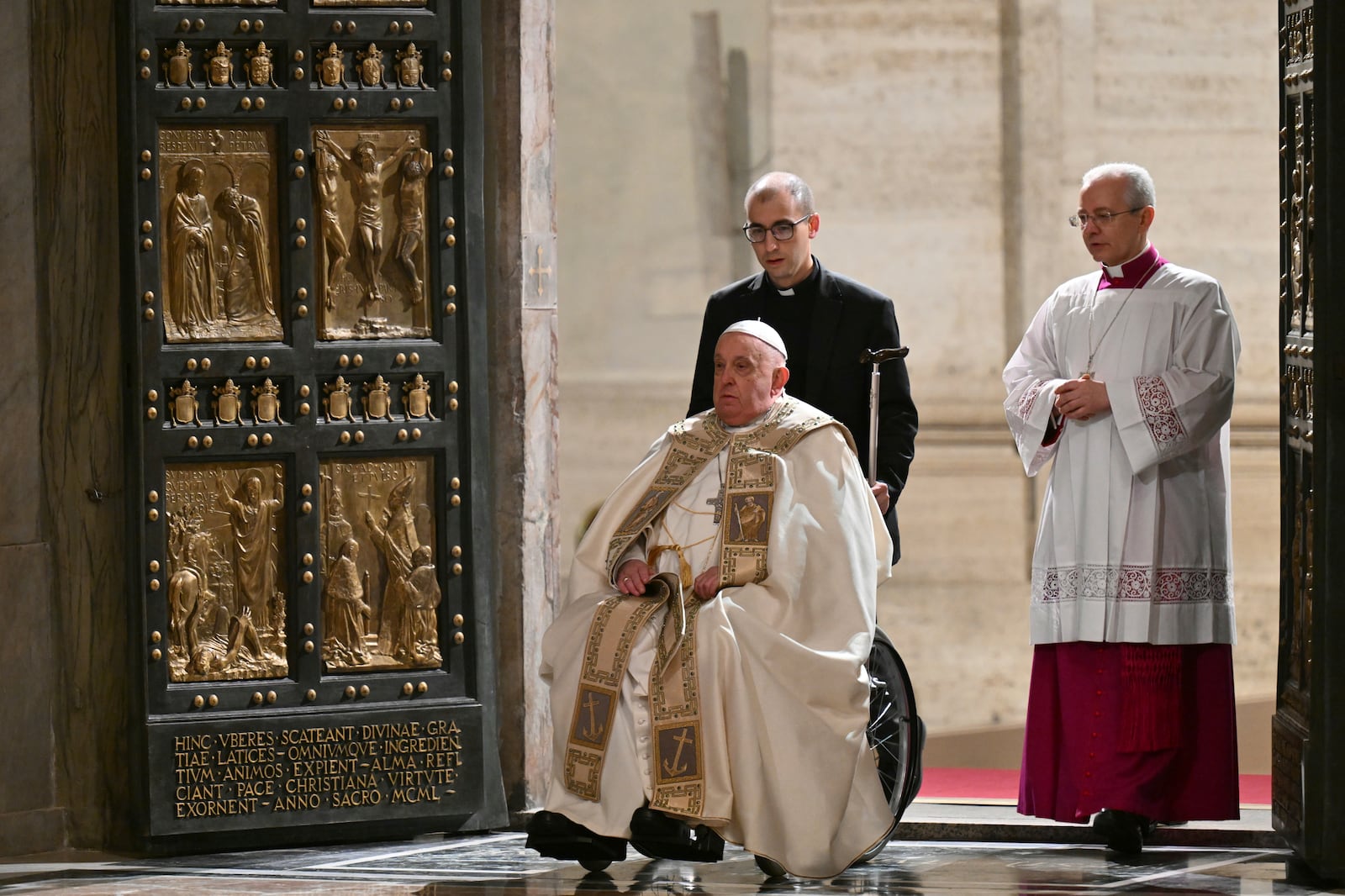 Pope Francis opens the Holy Door of St Peter's Basilica to mark the start of the Catholic Jubilee Year, at the Vatican, Dec. 24, 2024. (Alberto Pizzoli/Pool Photo via AP)