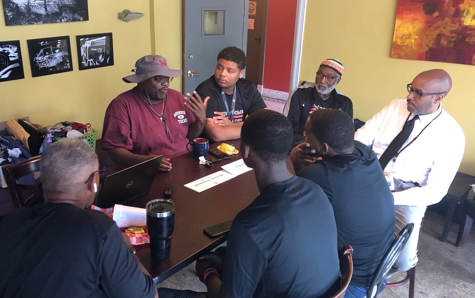 Community activist Marlon Shackelford talks to students and school and city leaders July 30 at the Third Perk Coffeehouse & Wine Bar downtown, discussing efforts to help more young black students succeed in life. JEREMY P. KELLEY / STAFF