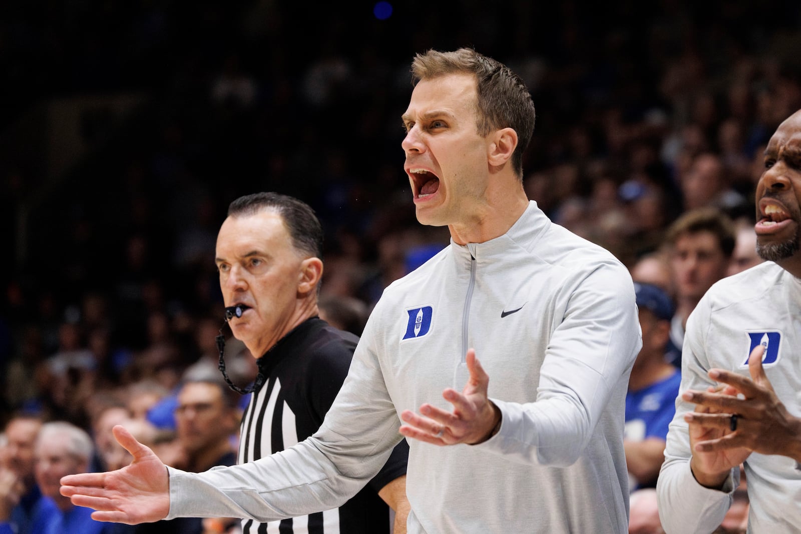 Duke head coach Jon Scheyer, center, reacts after a play during the first half of an NCAA college basketball game against Wake Forest in Durham, N.C., Monday, March 3, 2025. (AP Photo/Ben McKeown)