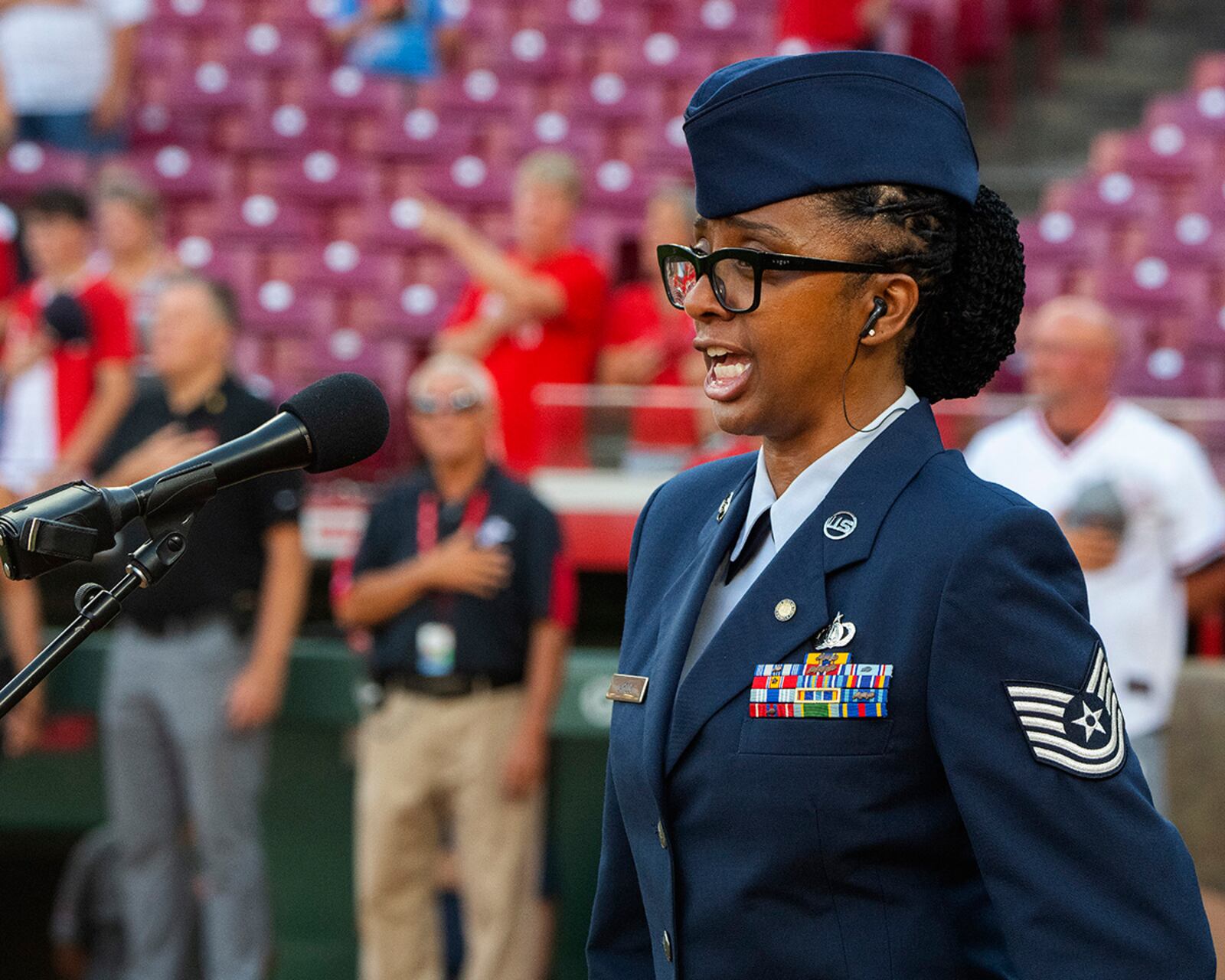 Retired Tech. Sgt. Felita LaRock sings the national anthem at the start of the Cincinnati Reds baseball game against the Colorado Rockies at Great American Ball Park in Cincinnati. LaRock was invited to sing the anthem as part of the Reds’ annual military appreciation night. U.S. AIR FORCE PHOTO/R.J. ORIEZ