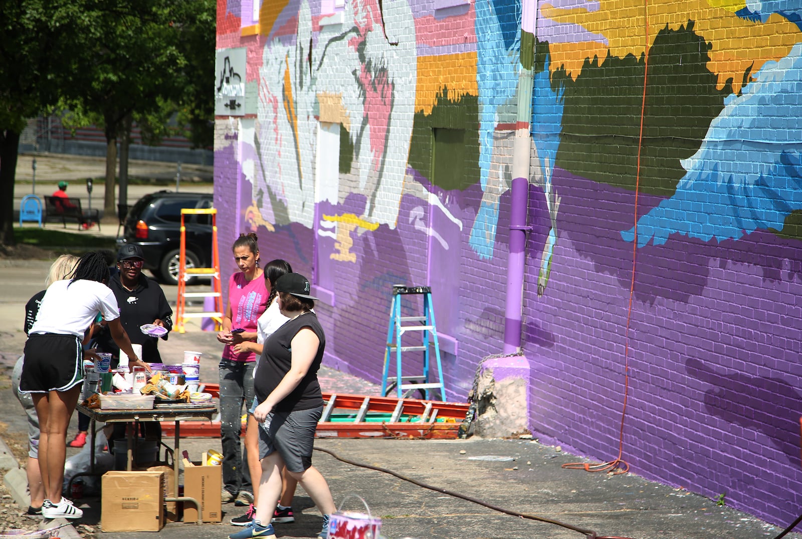 A new large-scale mural with an outdoor theme is underway on the south side of the Printpoint Printing building, 150 S. Patterson Blvd. The mural, entitled "Twighlight," is designed by artist Gae Helton. It is being produced by the K12 Gallery & TEJAS and artists in the Montgomery County Juvenile Court's HAALO Program. LISA POWELL / STAFF