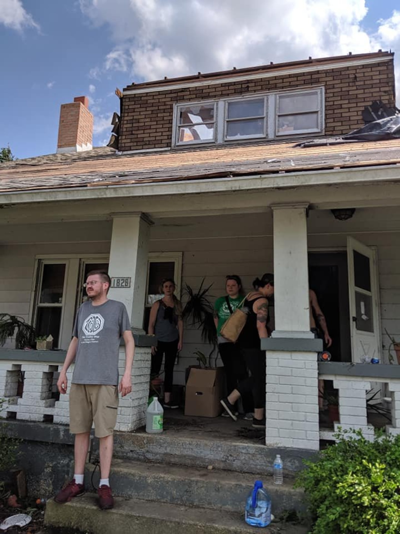 Friends and volunteers from the Oregon District worked to secure and clear Robin and Chris Sassenberg's Hillsdale Avenue home of debris the day following the Memorial Day tornadoes.