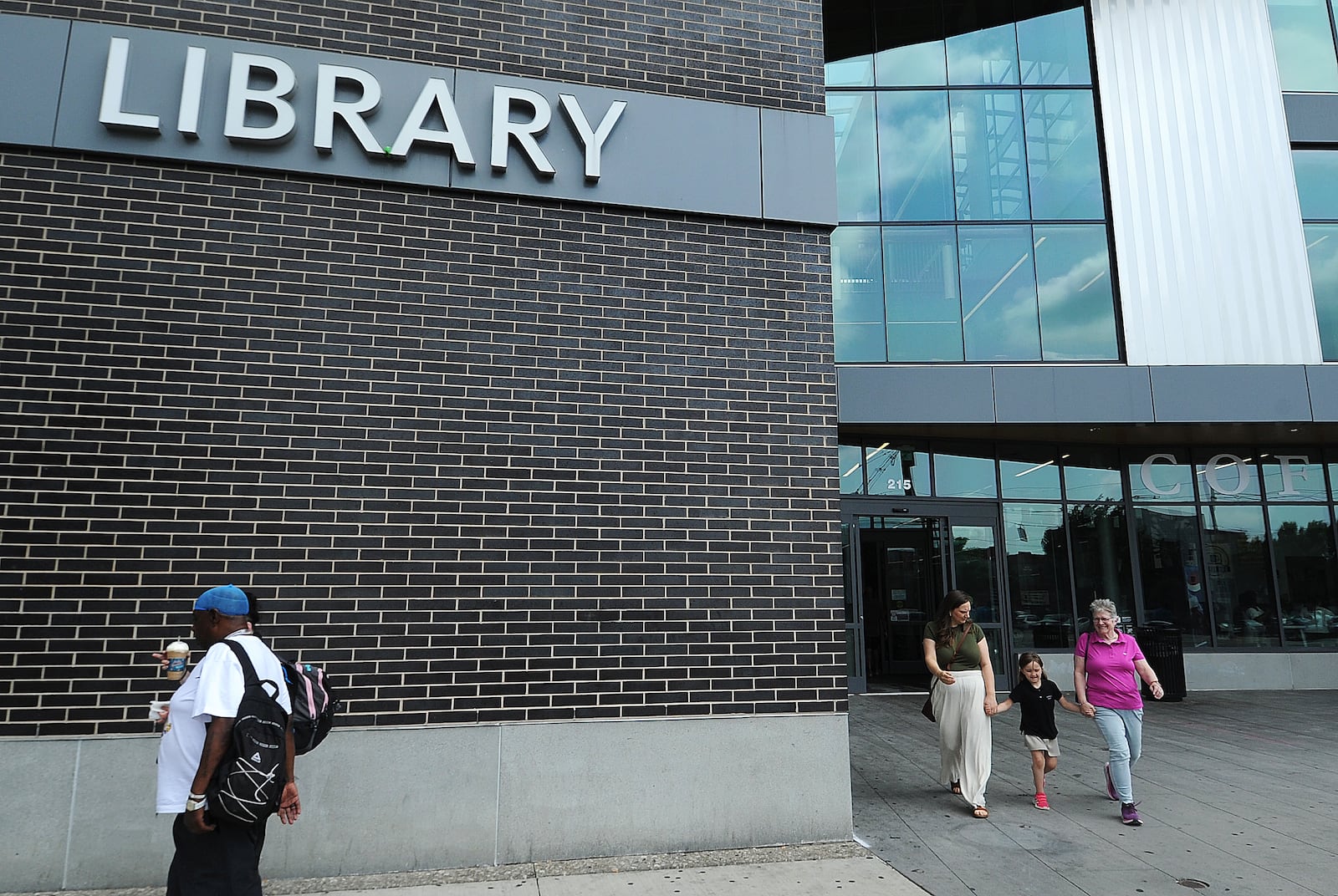 Lots of visitors coming and going Wednesday, May 22, 2024, at Dayton Metro Library’s main branch. MARSHALL GORBY\STAFF