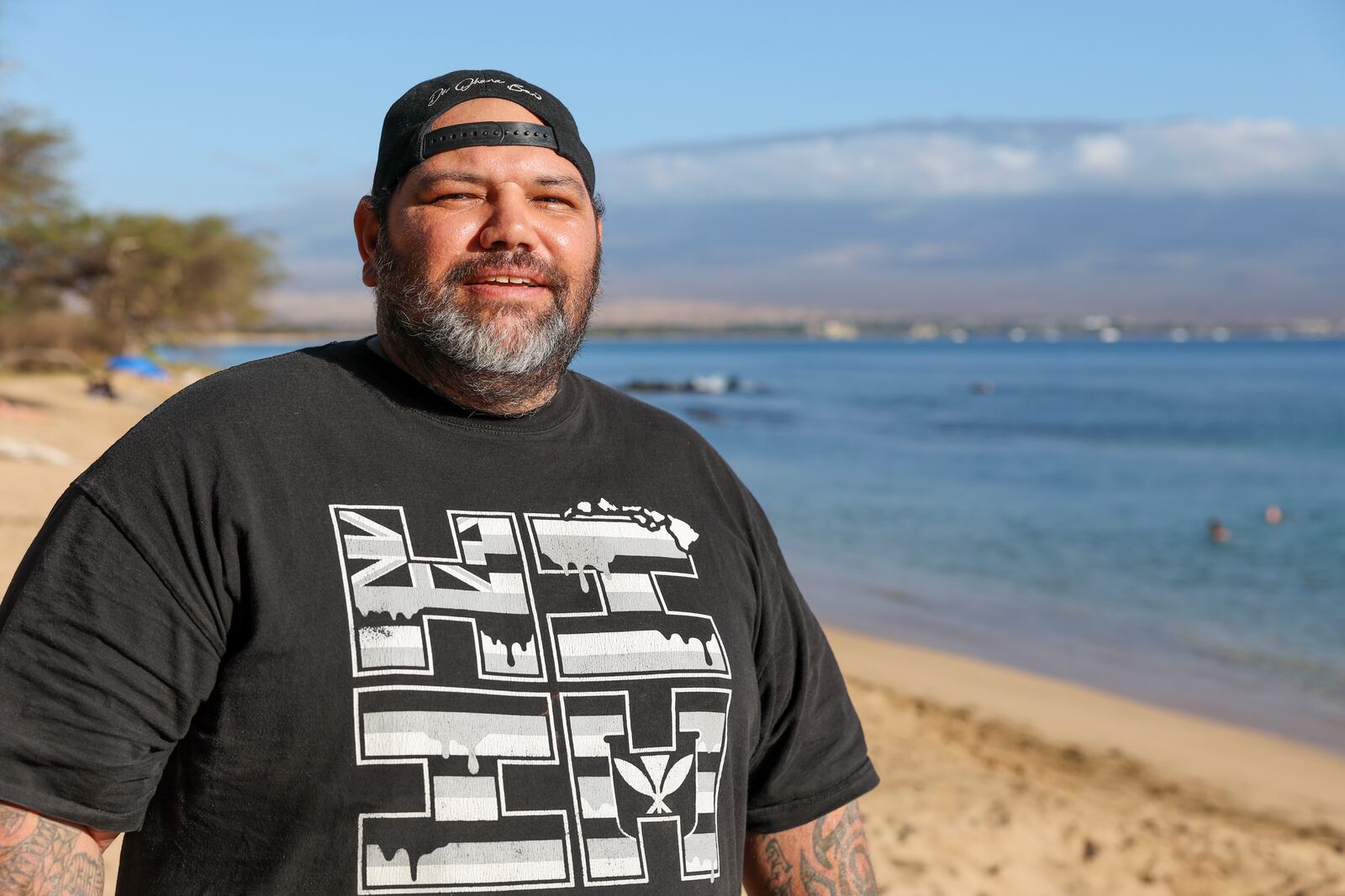 Joshua Kamalo, 43, is seen on the beach at Haycraft Park, Wednesday, Dec. 18, 2024, in Maalaea, Hawaii. (AP Photo/Marco Garcia)