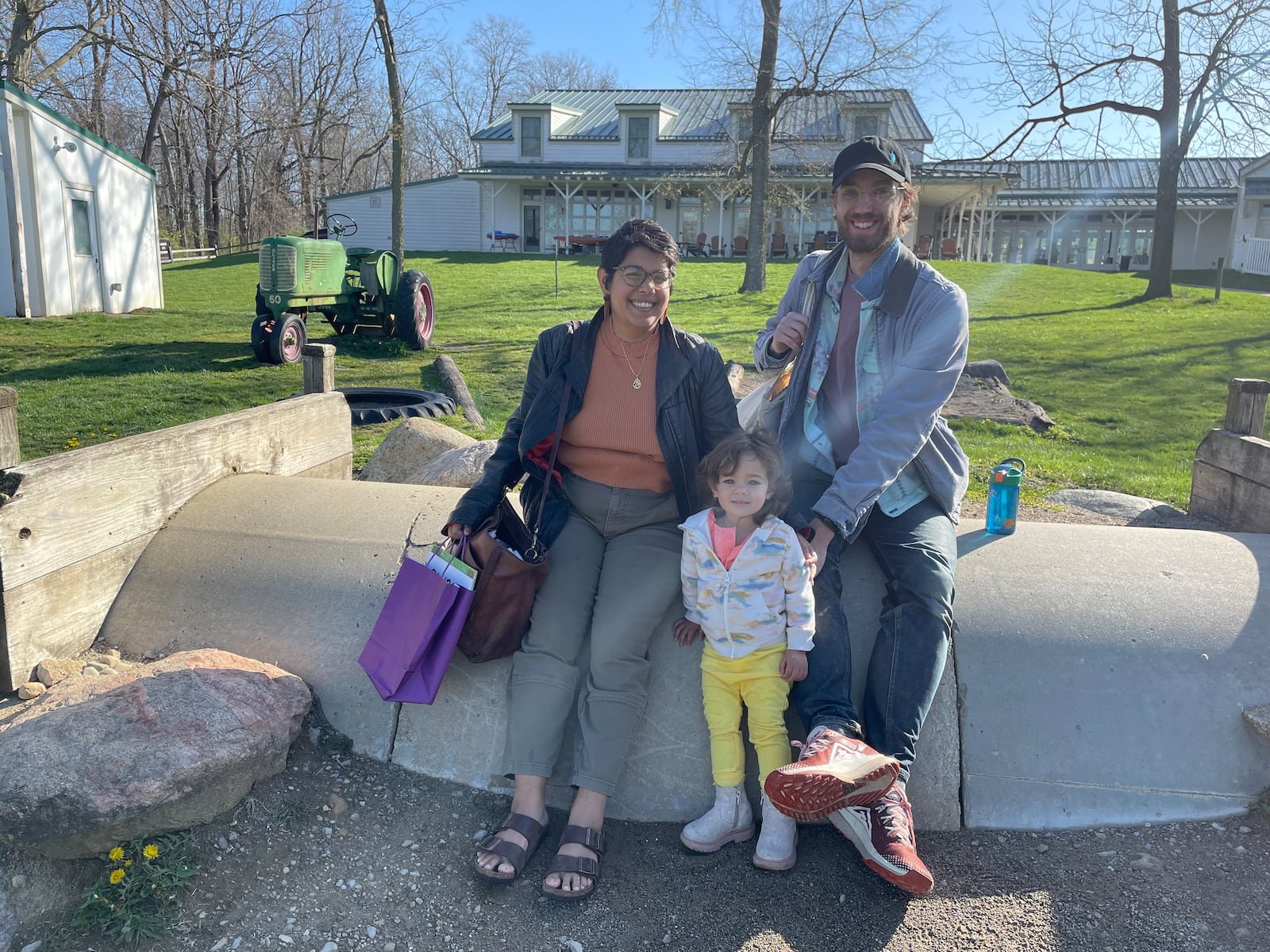 Nafeesa Dawoodbhoy and Nathan Heller drove from Chicago, Illinois with their daughter to meet a friend and his family from Pennsylvania at Aullwood Audubon in Dayton for the solar eclipse on Monday, April 8, 2024. NATALIE JONES/STAFF