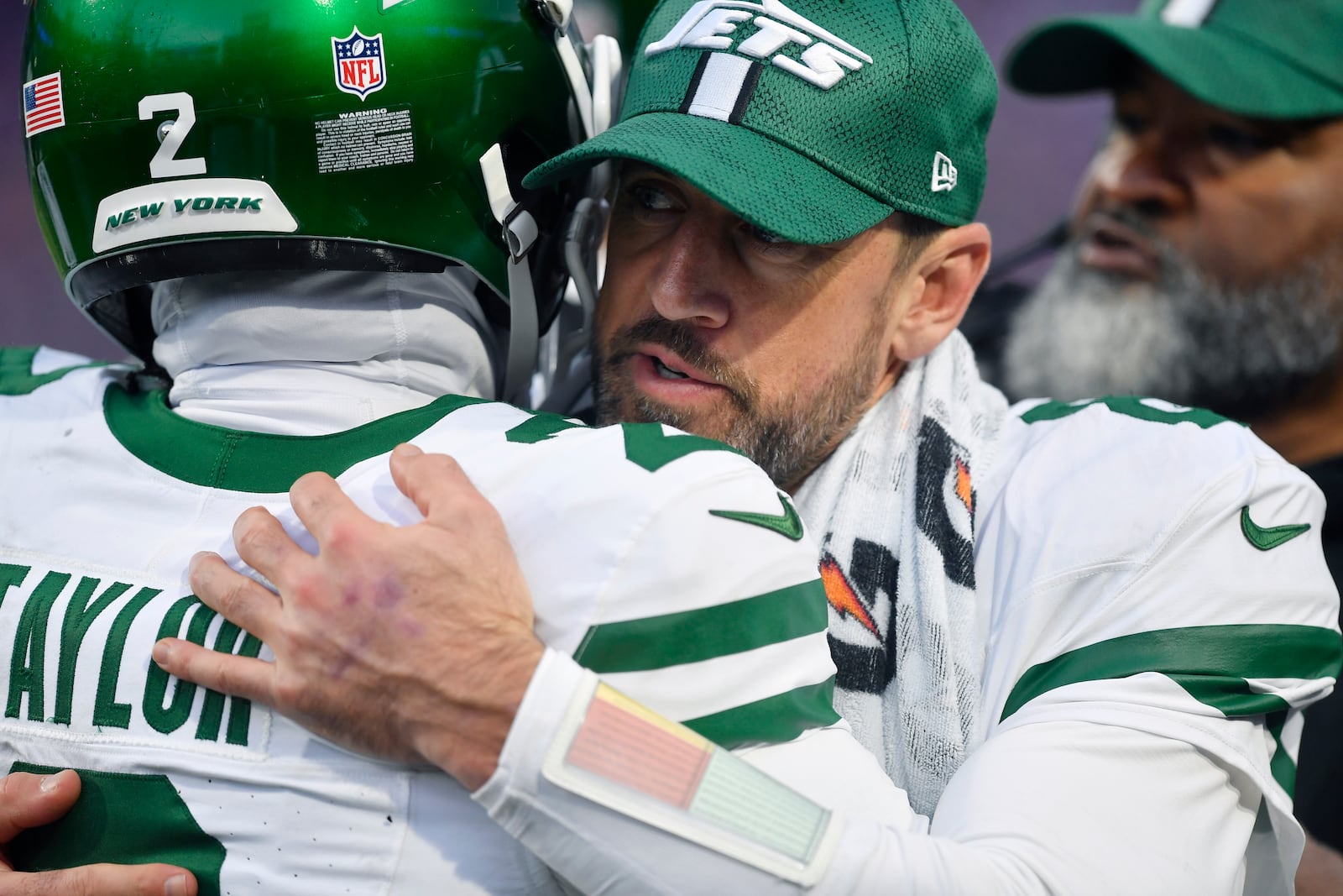 New York Jets quarterback Aaron Rodgers, left, hugs teammate quarterback Tyrod Taylor (2) after a touchdown during the second half of an NFL football game against the Buffalo Bills, Sunday, Dec. 29, 2024, in Orchard Park, N.Y. (AP Photo/Adrian Kraus)