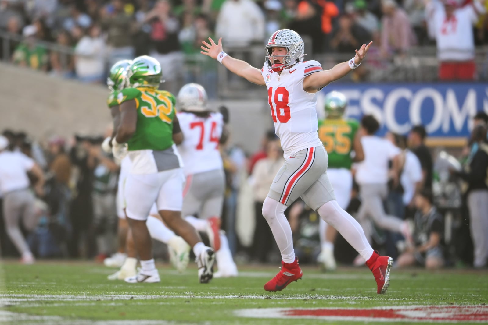 Ohio State quarterback Will Howard (18) celebrates a touchdown against Oregon during the first half in the quarterfinals of the Rose Bowl College Football Playoff, Wednesday, Jan. 1, 2025, in Pasadena, Calif. (AP Photo/Kyusung Gong)