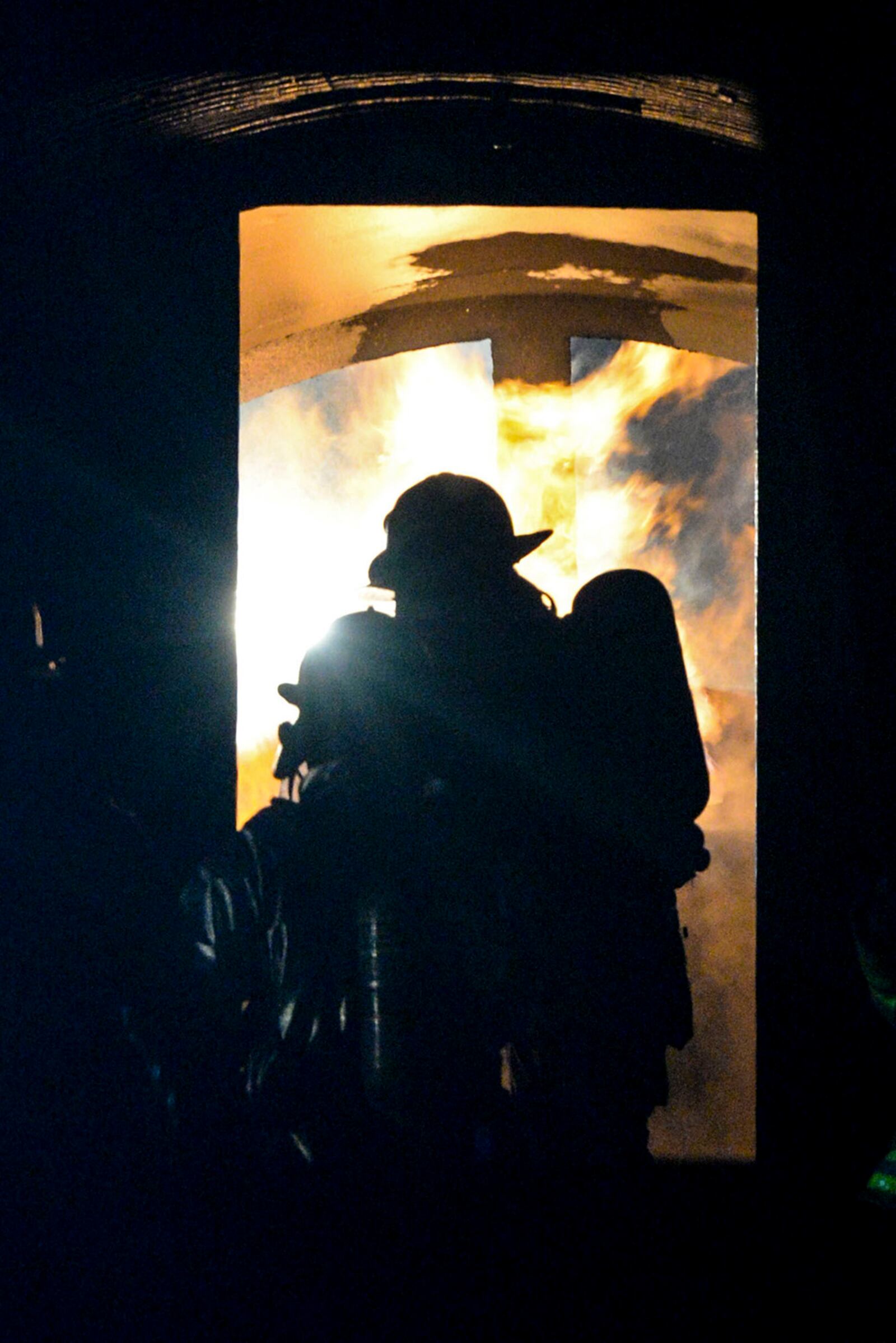 Firefighters from the 788th Civil Engineer Squadron tackle an internal aircraft-fuselage fire at their training burn pit Sept. 19, 2016, on Wright-Patterson Air Force Base. Crews also fought to put out an external aircraft blaze, in addition to searching for “victims” as part of the routine training. U.S. AIR FORCE PHOTO/WESLEY FARNSWORTH