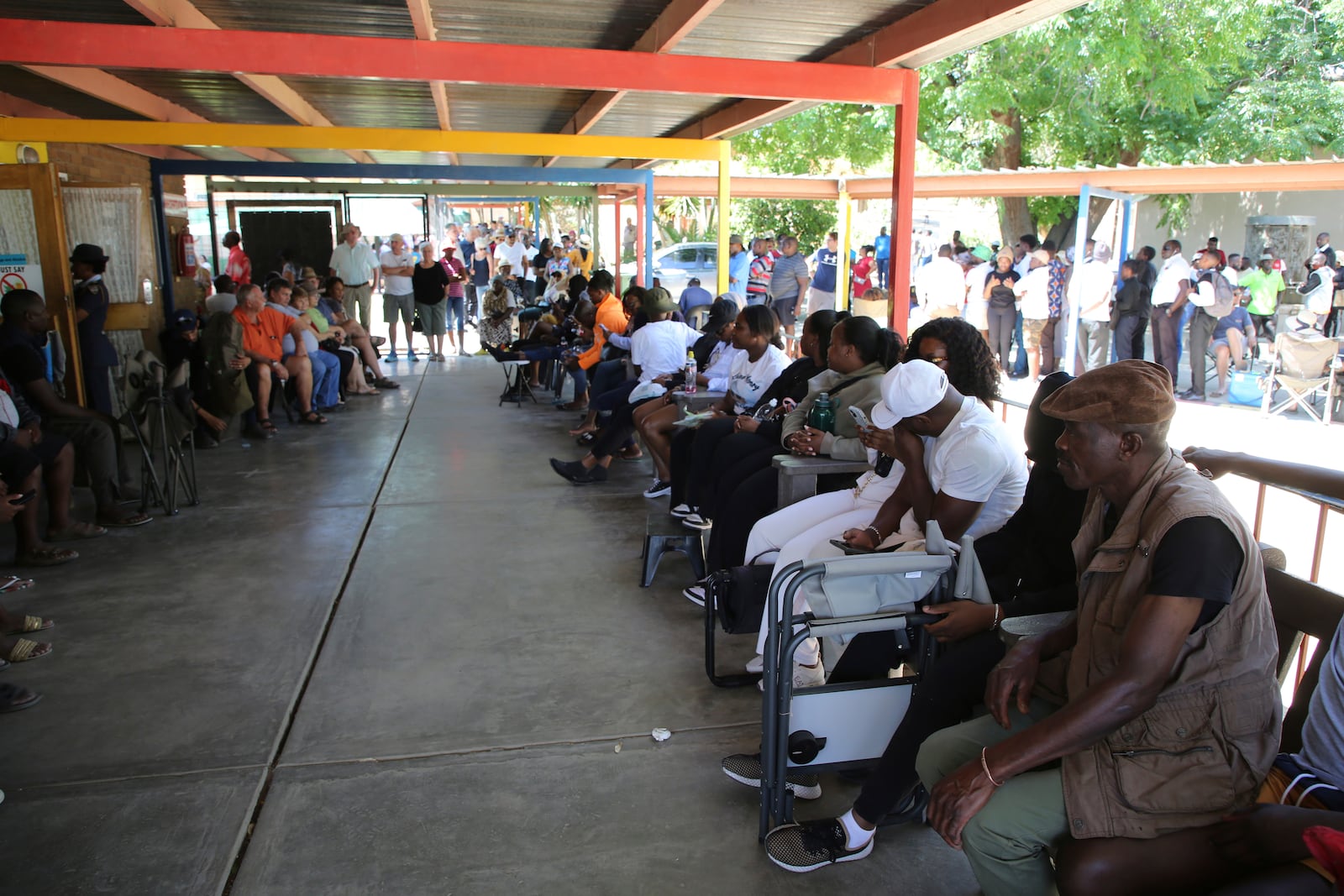 Namibians queue to cast their votes in presidential elections in Windhoek, Namibia, Wednesday, Nov. 27, 2024. (AP Photo/Dirk Heinrich)