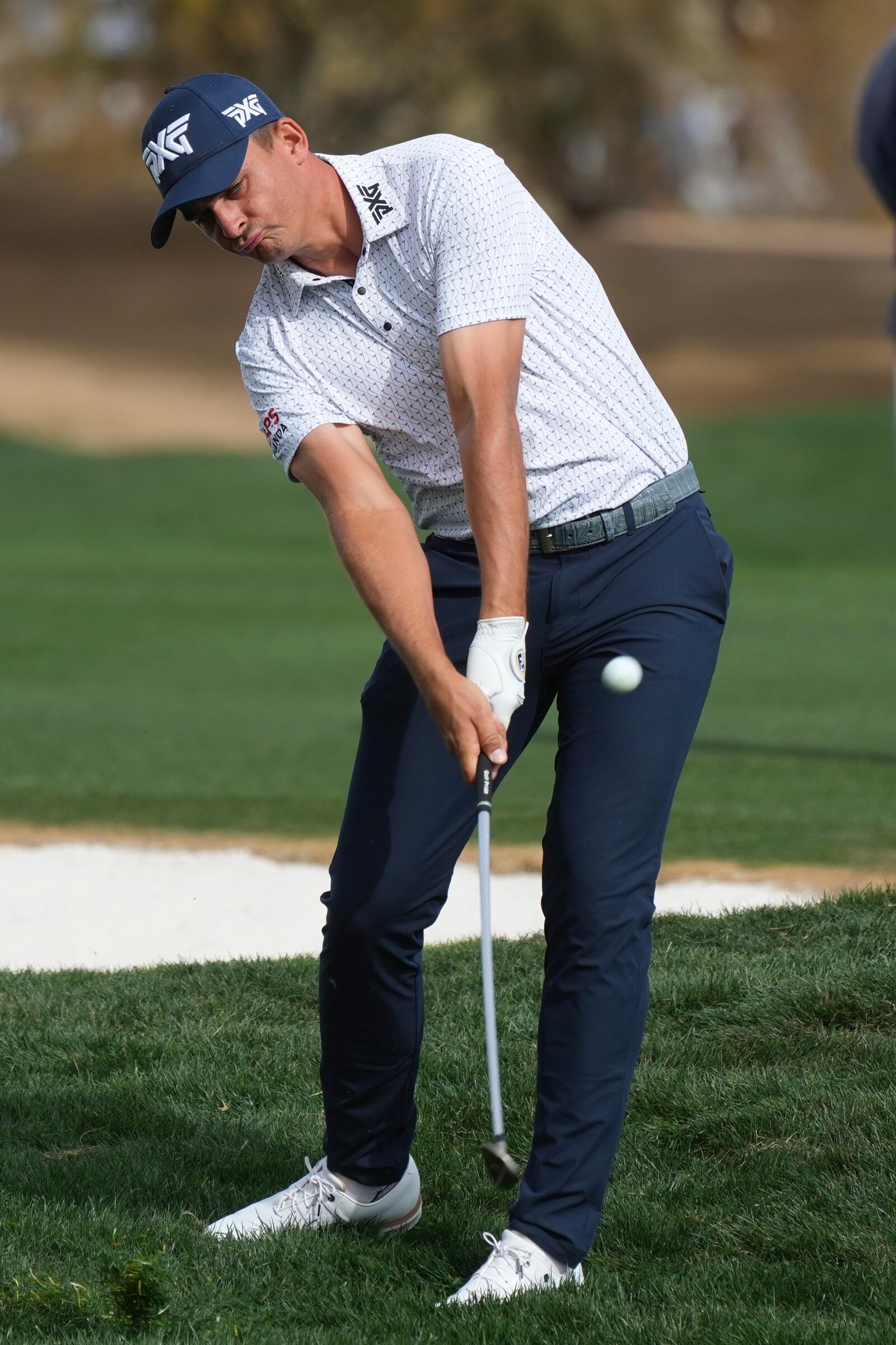 Christiaan Bezuidenhout, of South Africa, hits his approach shot on the second hole during the final round of the Phoenix Open golf tournament at TPC Scottsdale, Sunday, Feb. 9, 2025, in Scottsdale, Ariz. (AP Photo/Ross D. Franklin)