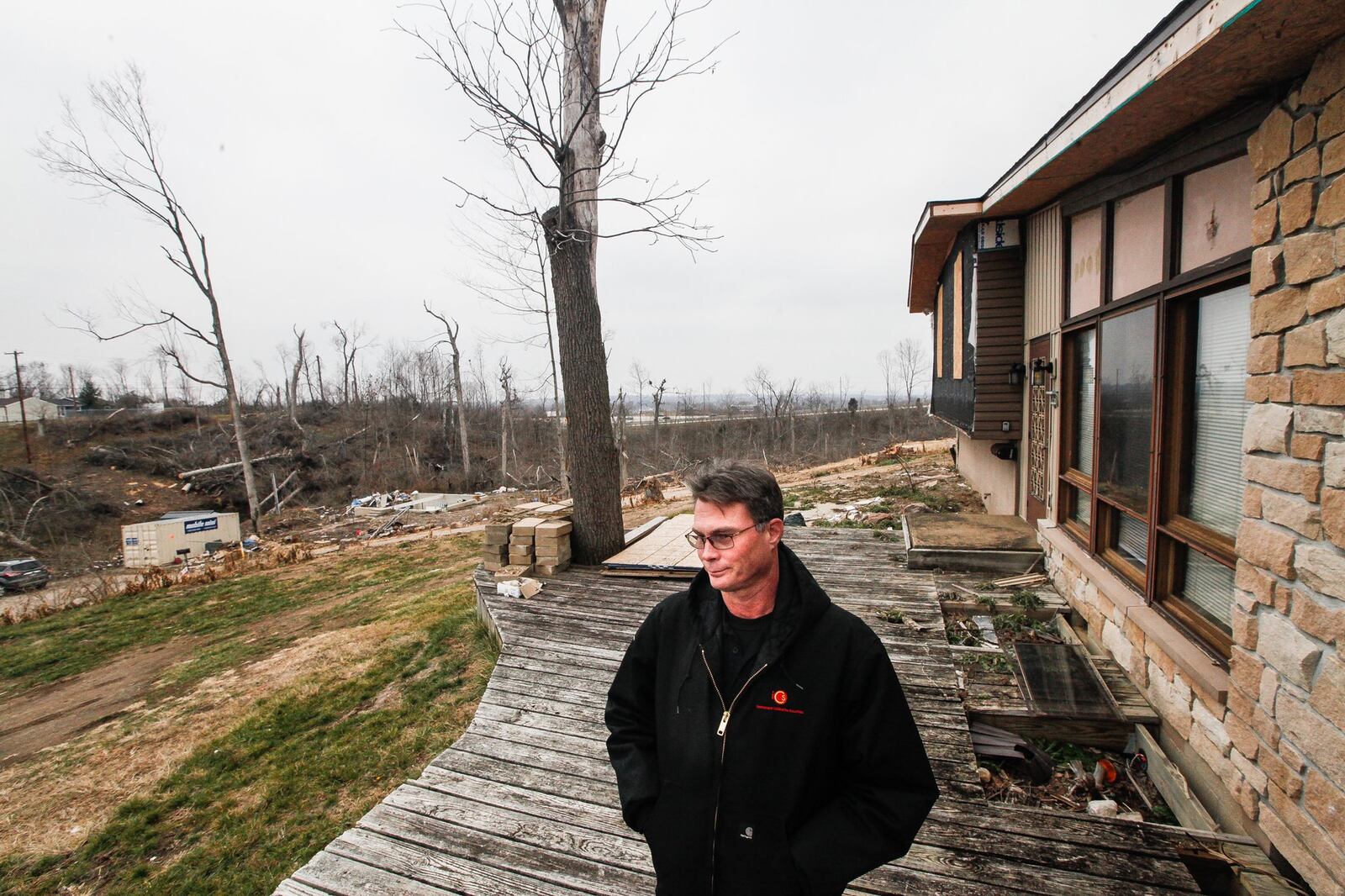 Aaron Krueger could barely see neighborsâ€™ homes from his on Murwood Court in Beavercreek before the Memorial Day tornadoes swept through heavily wooded Grange View Acres. Now some of the homes are gone and others are in plain view. CHRIS STEWART / STAFF