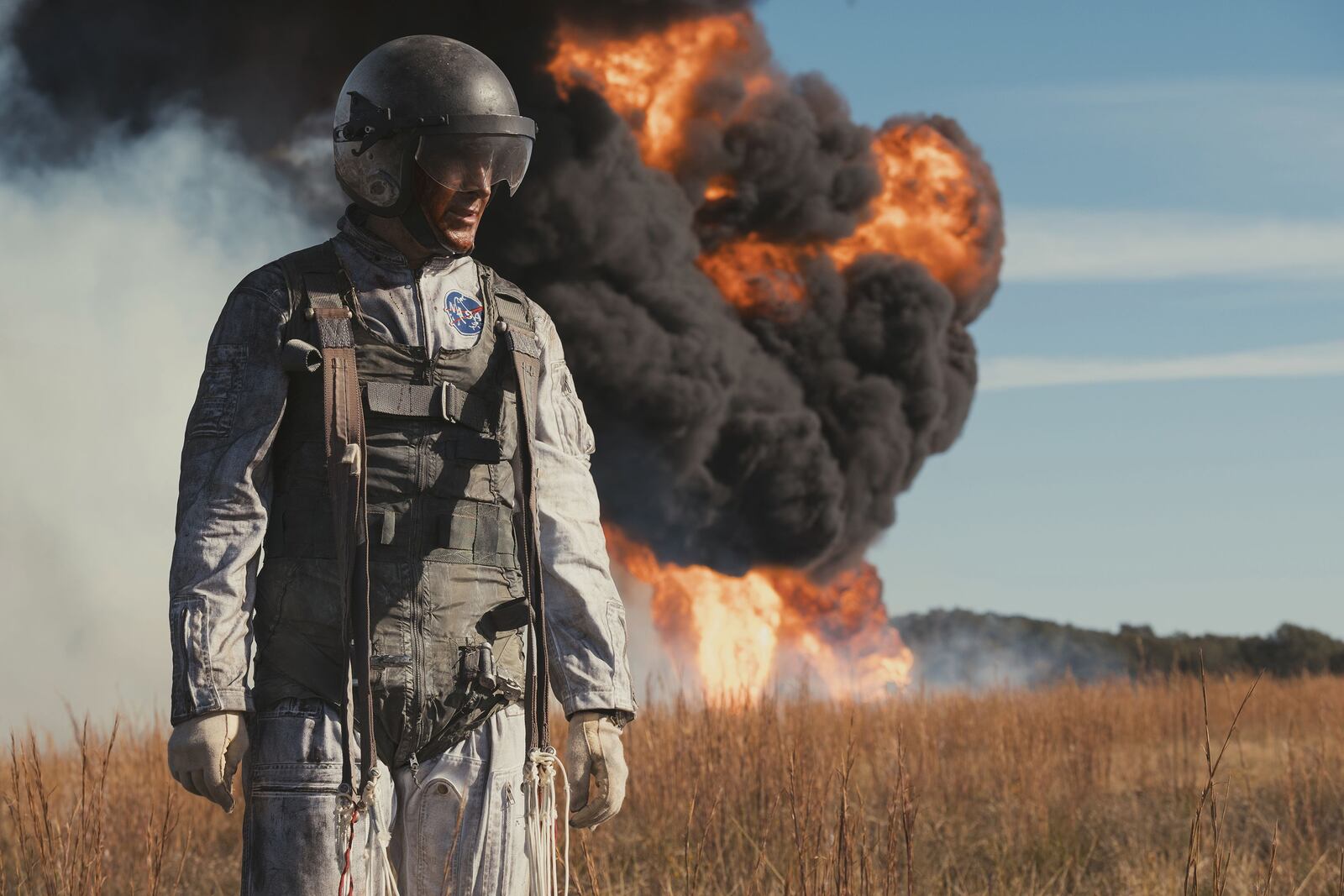 Neil Armstrong (Ryan Gosling) narrowly escapes his lunar training vehicle before it crashes and burns in "First Man."