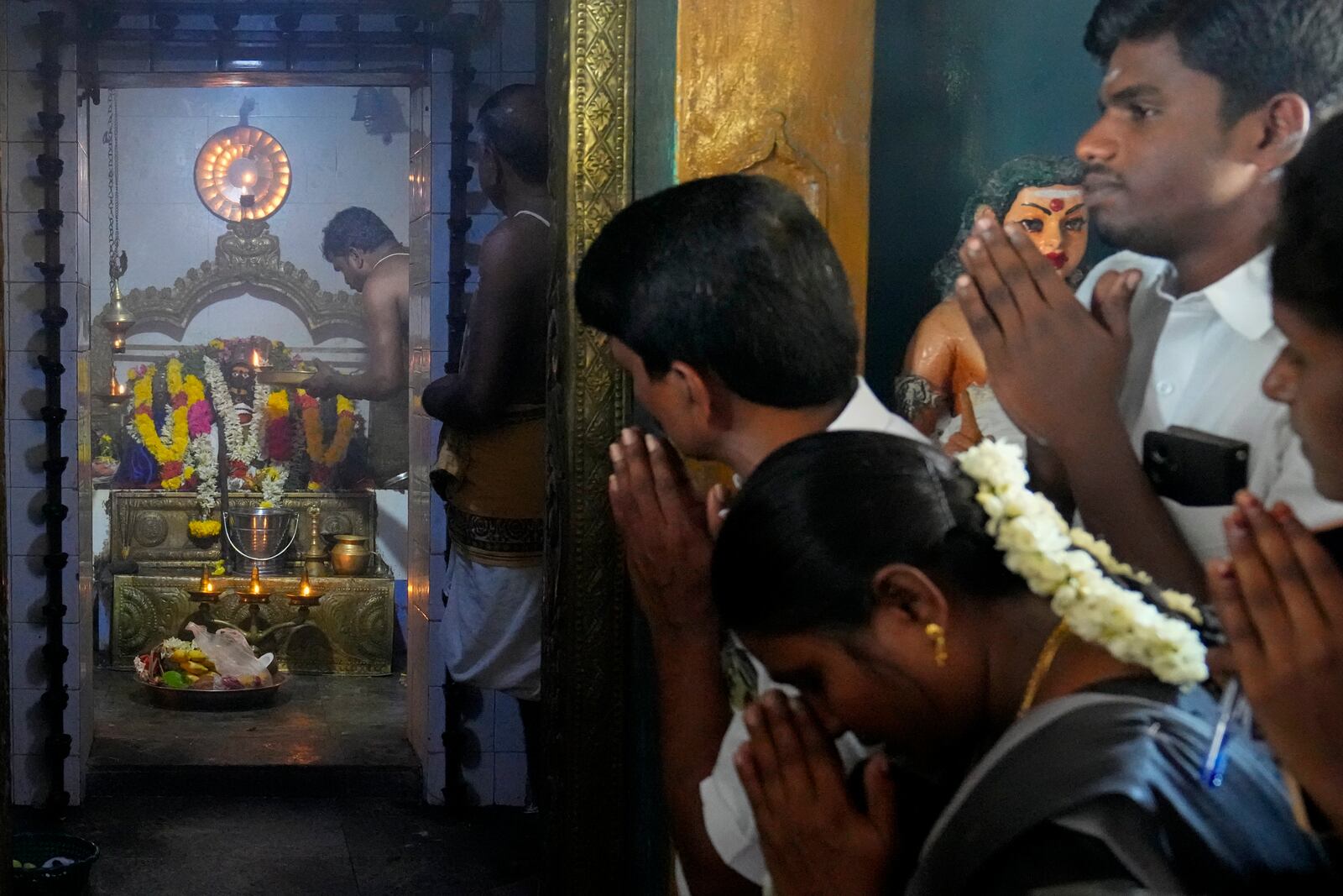 Villagers participate in the special prayers for the victory of Democratic presidential nominee Vice President Kamala Harris, at Sri Dharmasastha Hindu temple in Thulasendrapuram, the ancestral village of Harris, in Tamil Nadu state, India, Tuesday, Nov. 5, 2024. (AP Photo/Aijaz Rahi)