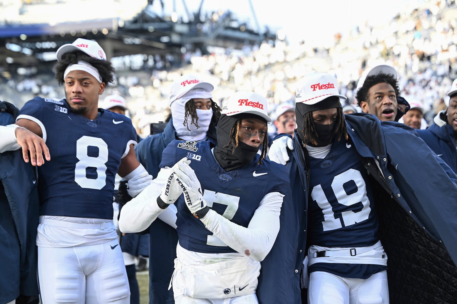 Penn State players celebrate after their win over SMU in the first round of the College Football Playoff, Saturday, Dec. 21, 2024, in State College, Pa. (AP Photo/Barry Reeger)