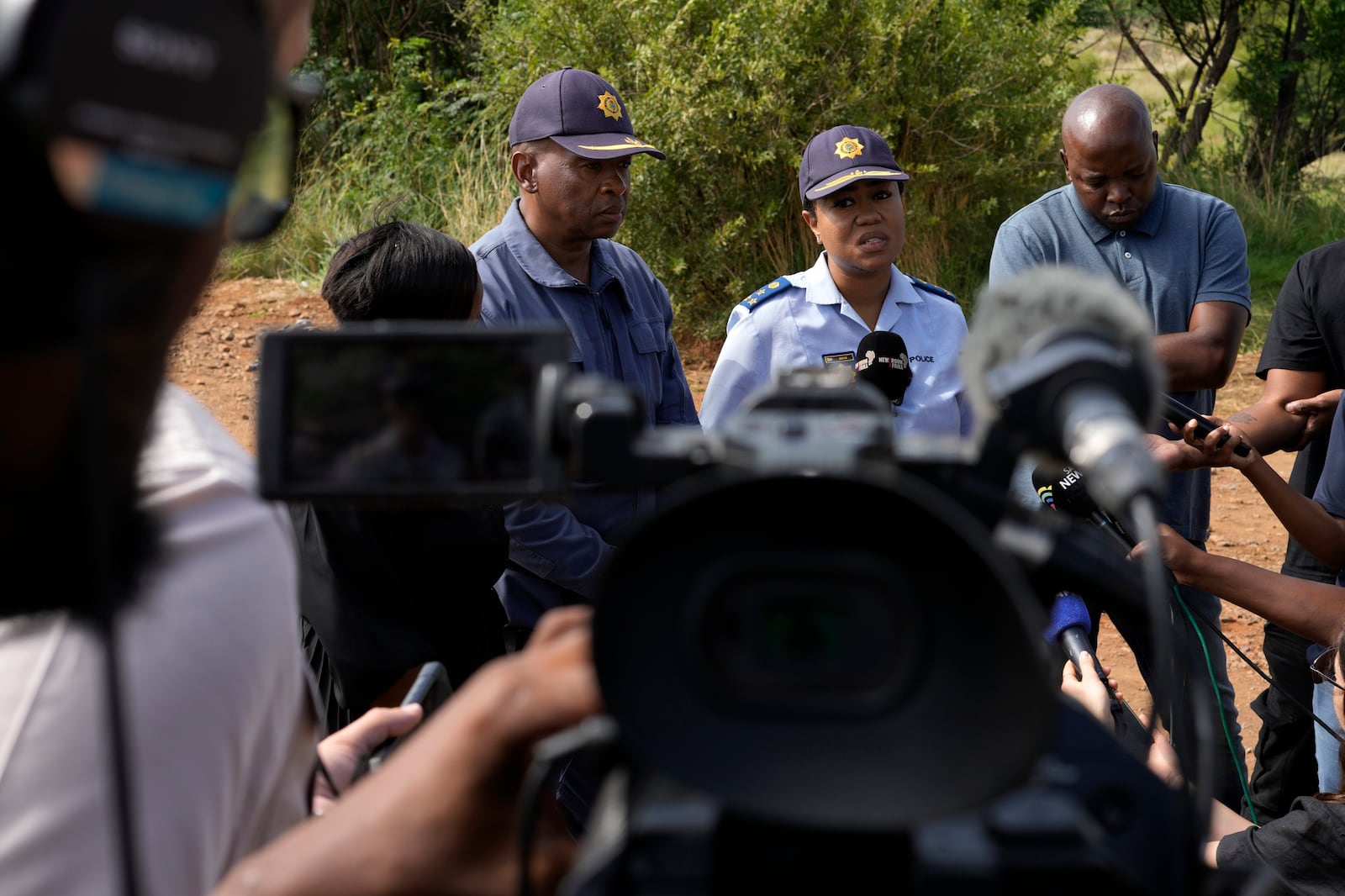 National police spokesperson Athlenda Mathe, speaks to journalist outside an abandoned gold mine, where miners are rescued from below ground, in Stilfontein, South Africa, Thursday, Jan. 16, 2025. (AP Photo/Themba Hadebe)