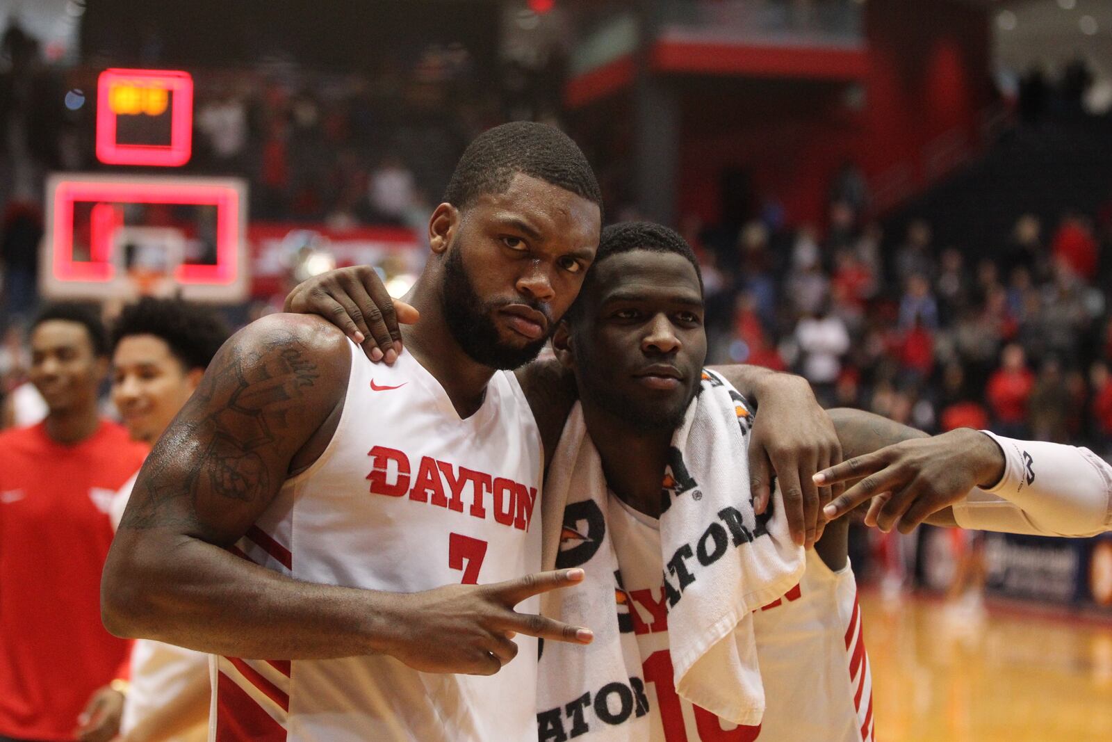 Dayton’s Trey Landers and Jalen Crutcher pose for a photo after a victory against Richmond on Sunday, Jan. 6, 2019, at UD Arena. David Jablonski/Staff