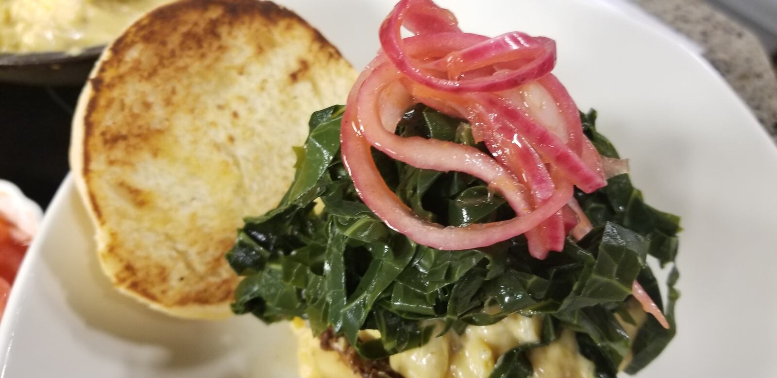 Specialty sandwiches at The Chicken Spot will include the Medusa, a chicken sandwiches topped with a cavatappi noodle Mac and Cheese, collard greens cut into ribbons and pickled onions.