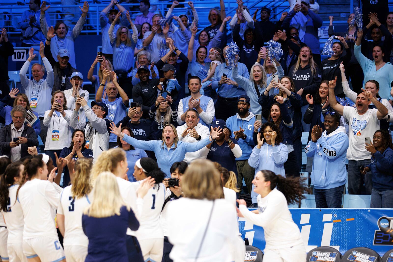 Columbia fans celebrate after the team defeated Washington in a First Four college basketball game in the NCAA Tournament in Chapel Hill, N.C. Thursday, March 20, 2025. (AP Photo/Ben McKeown)