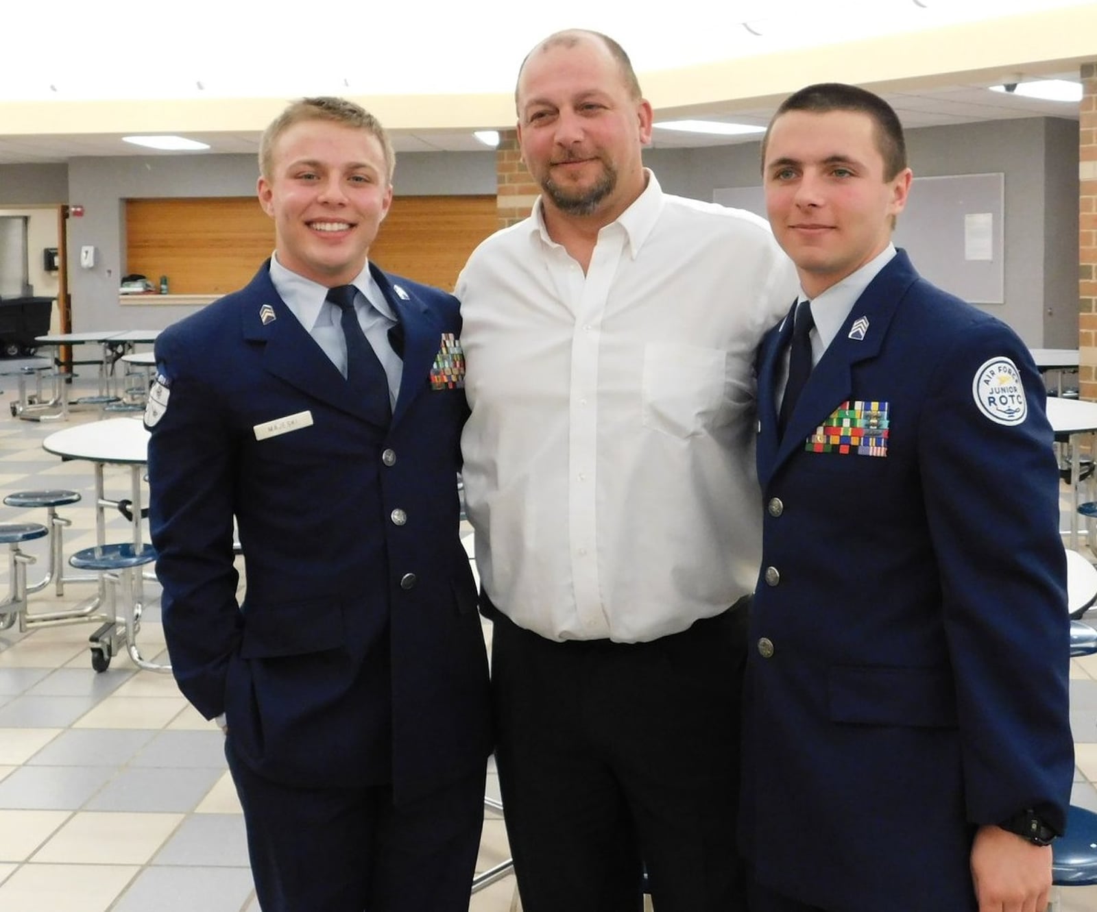 Brian Majeski of Springboro with his sons, Zach Majeski, left, and Evan Majeski. Zach joined the Navy in June and Evan will join the Army in 2019.