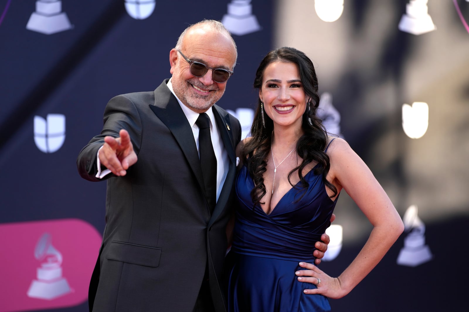 FILE - Manuel Abud, CEO of the Latin Recording Academy, left, and Marien Abud Winston pose for photos as they arrive at the 23rd Annual Latin Grammy Awards at the Mandalay Bay Michelob Ultra Arena, in Las Vegas, Nov. 17, 2022. (AP Photo/John Locher, File)