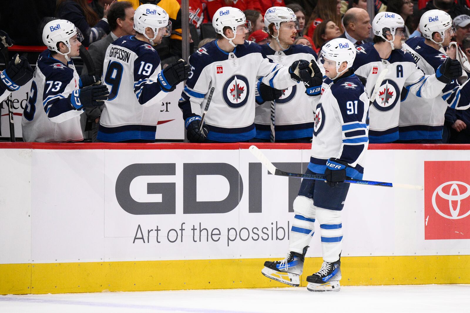 Winnipeg Jets center Cole Perfetti (91) celebrates after his goal during the first period of an NHL hockey game against the Washington Capitals, Saturday, Feb. 1, 2025, in Washington. (AP Photo/Nick Wass)