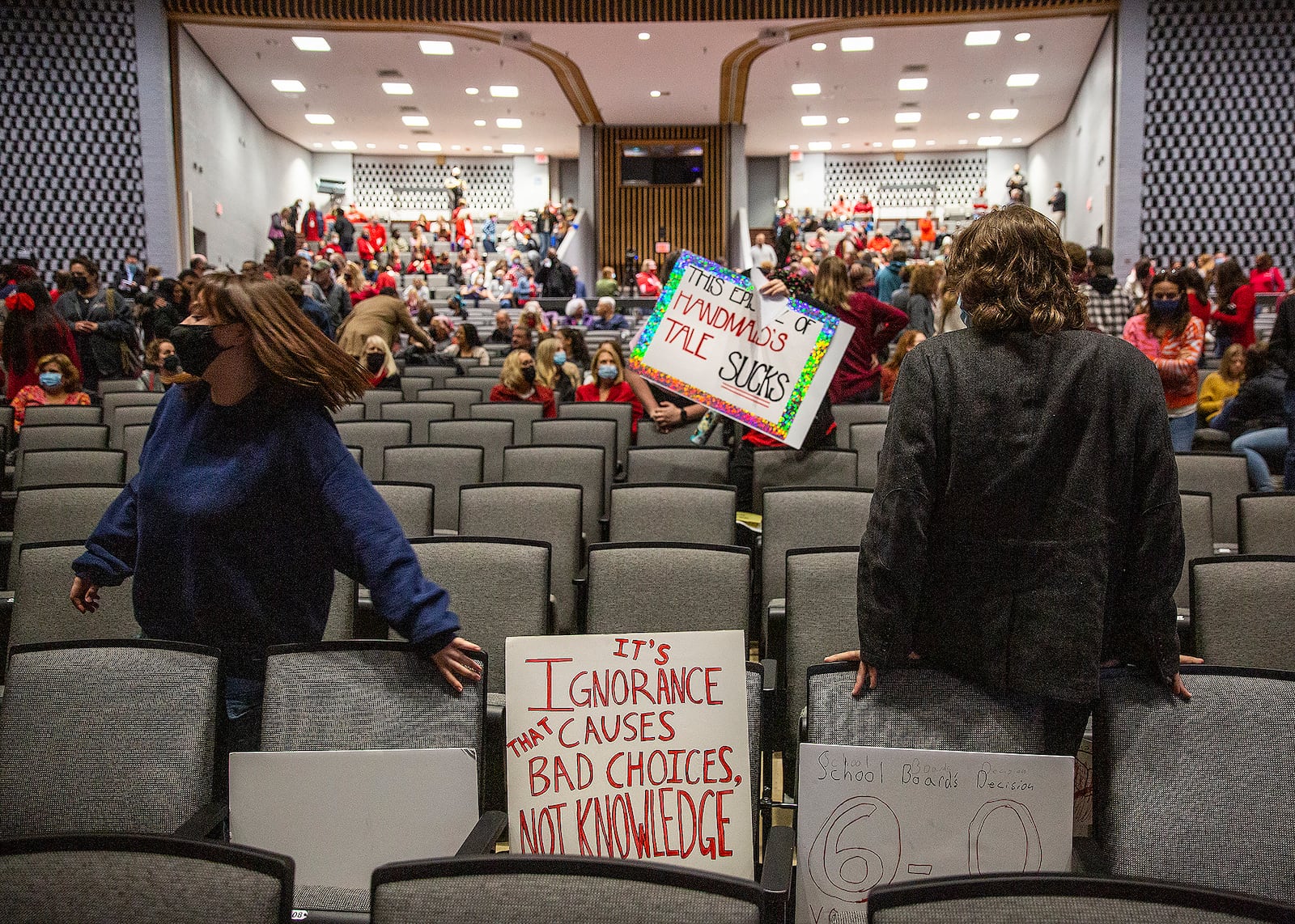 Spotsylvania County School Board meeting attendees begin to regroup before public comments at Chancellor High School in Spotsylvania County, Va. on Monday, Nov. 15, 2021. The Virginia school board rescinded a directive for staff to pull books with “sexually explicit” books from libraries early Tuesday after hours of passionate public comment. (Peter Cihelka/The Free Lance-Star via AP)