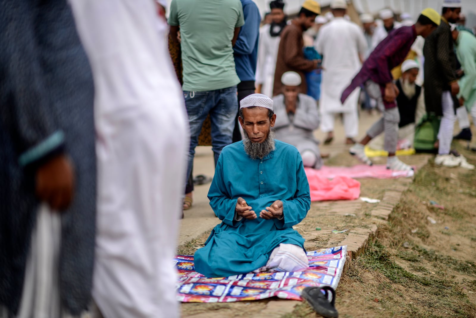 A Muslim devotee prays during the first phase of the three-day Biswa Ijtema, or the World Congregation of Muslims, at the banks of the Turag river in Tongi, near Dhaka, Bangladesh, Friday, Jan. 31, 2025. (AP Photo/Mahmud Hossain Opu)