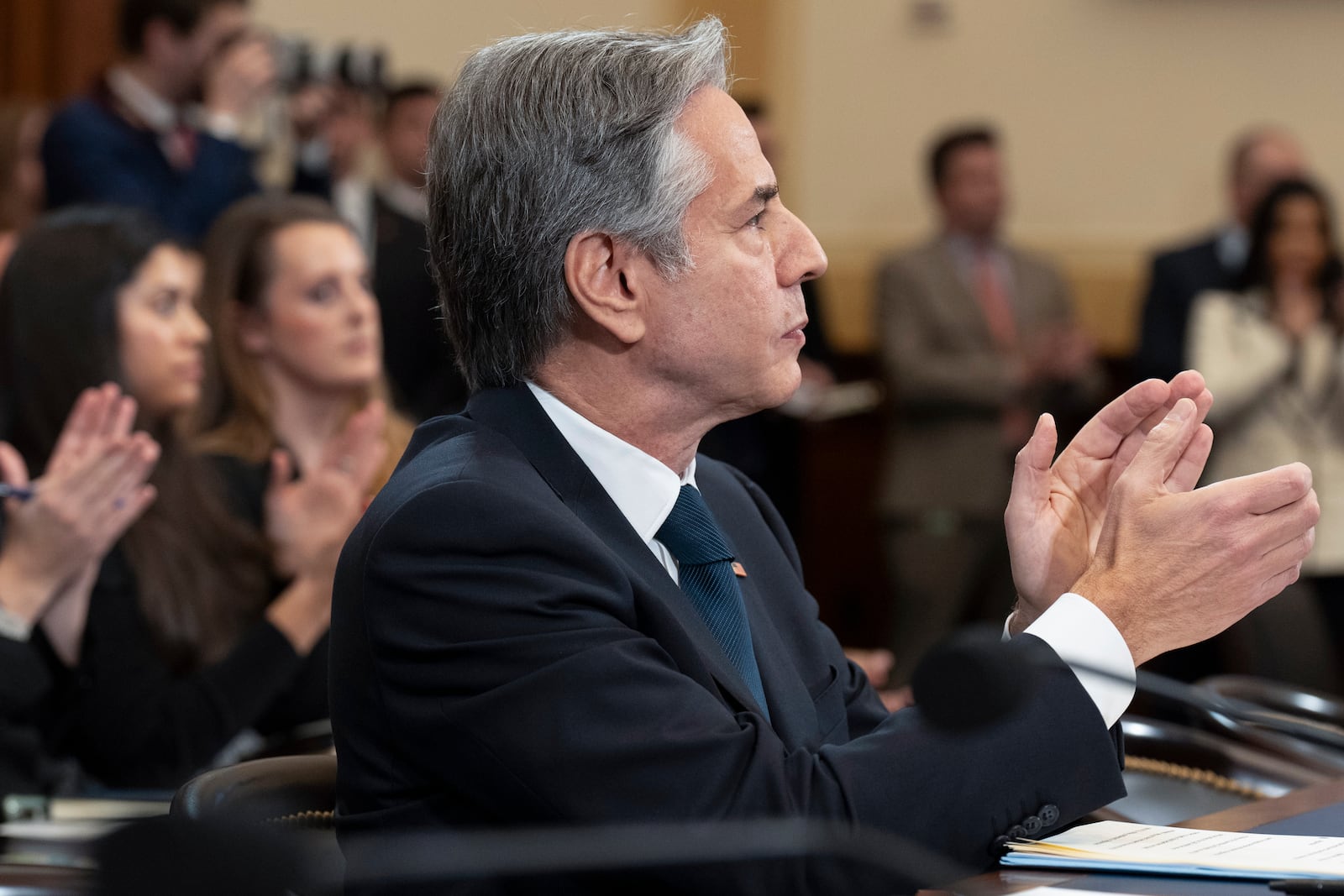 Secretary of State Antony Blinken, along with attendees of a House Committee on Foreign Affairs, applaud during a hearing on the US withdrawal from Afghanistan, Wednesday, Dec. 11, 2024, on Capitol Hill in Washington. (AP Photo/Jacquelyn Martin)